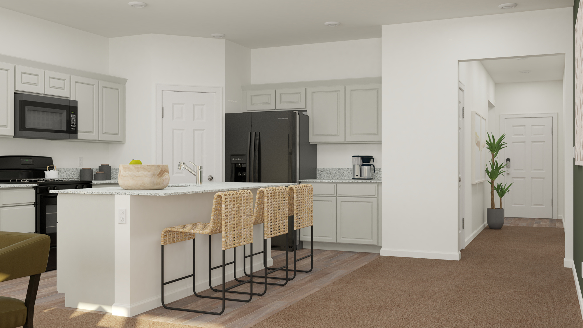 A kitchen with white cabinets.