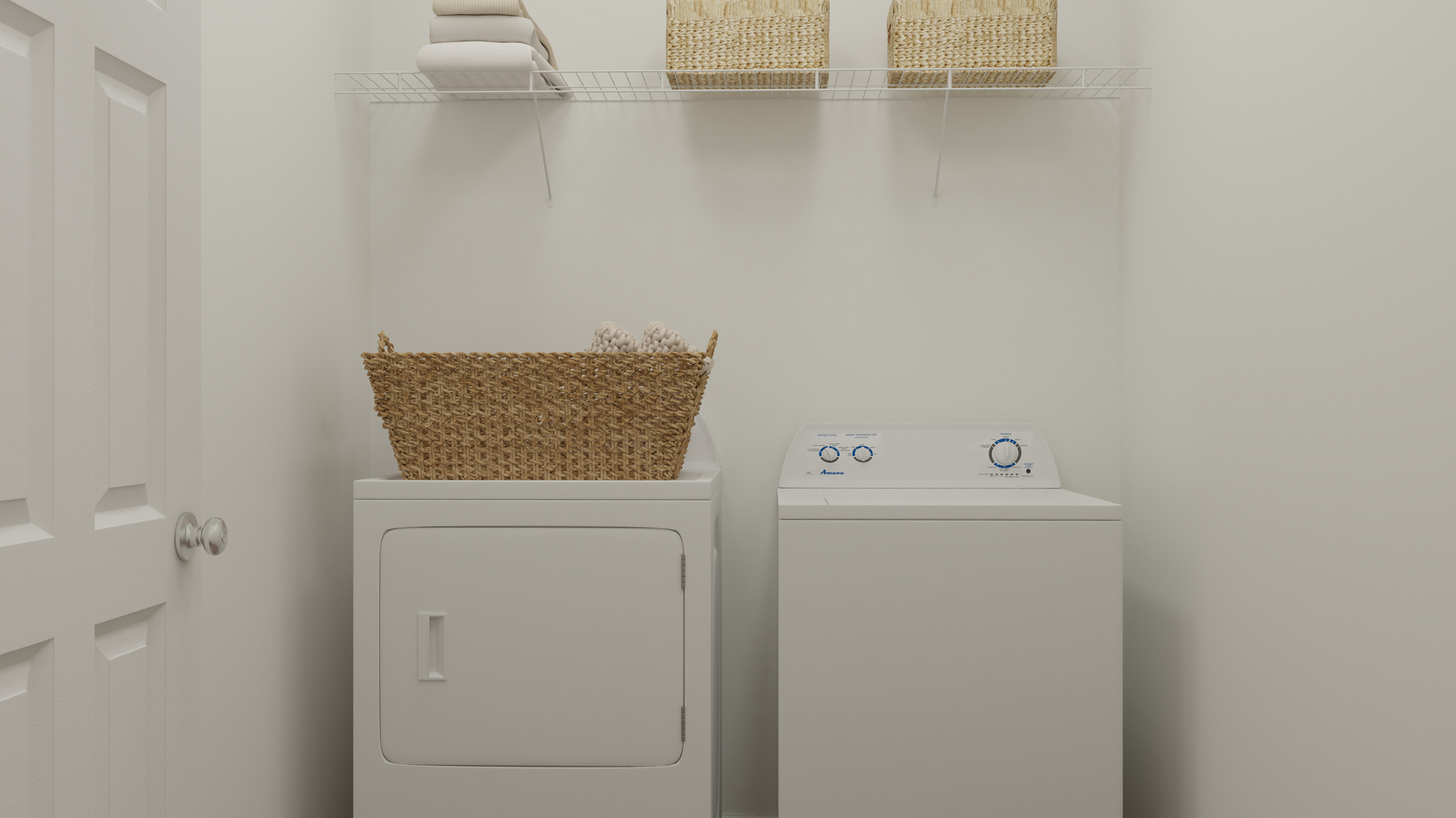 A white wall with a basket on it and a white cabinet with a basket on top.