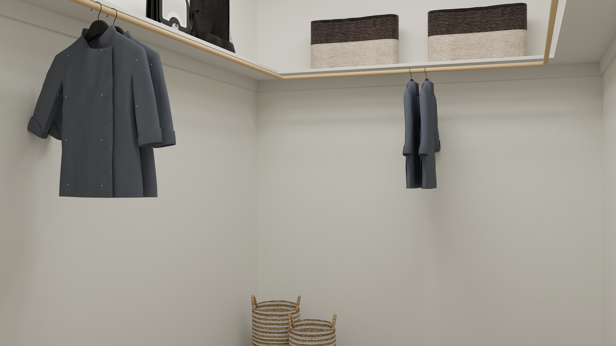 A couple of black coats on a wall.