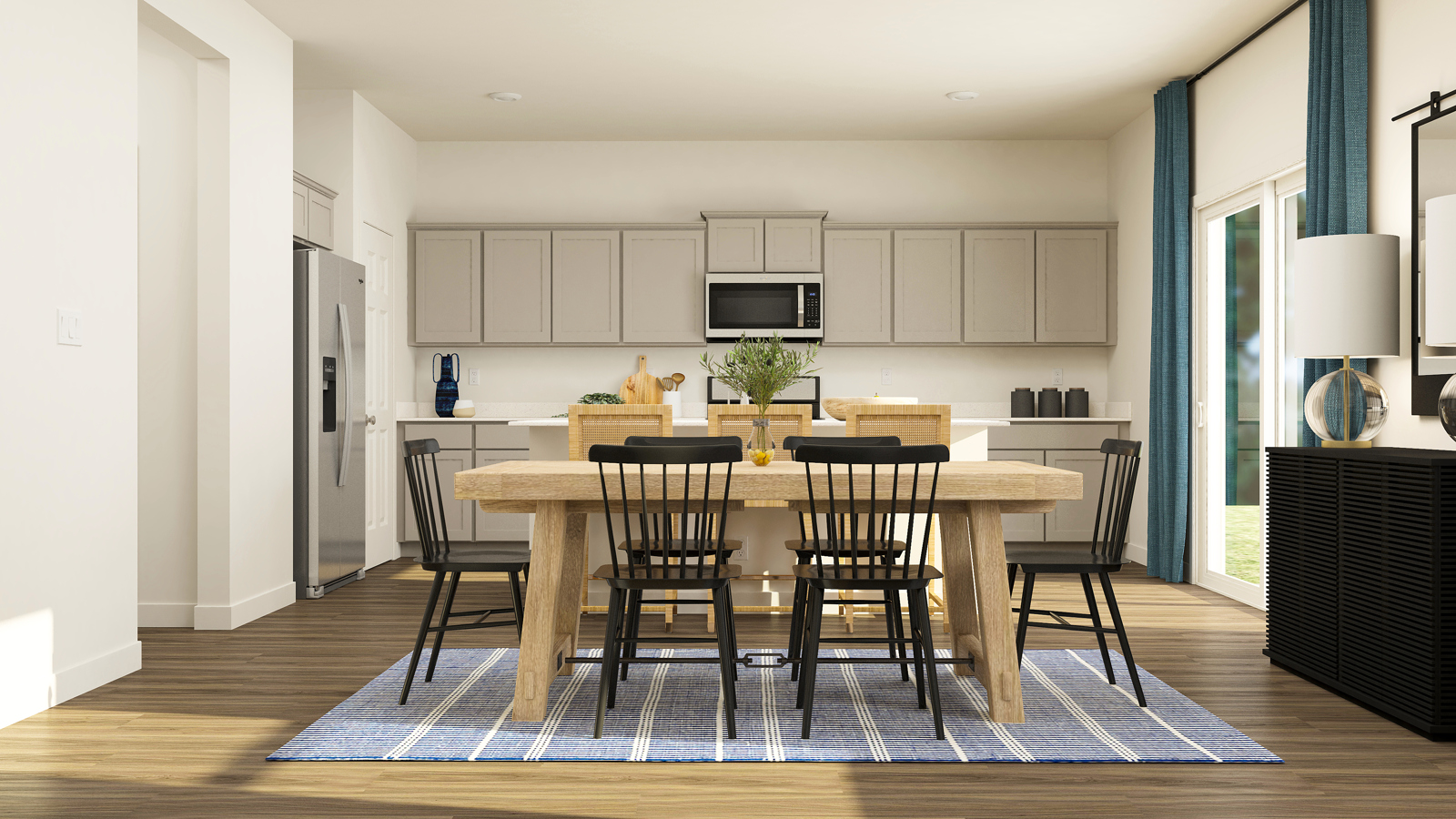 A kitchen with a dining table and chairs.