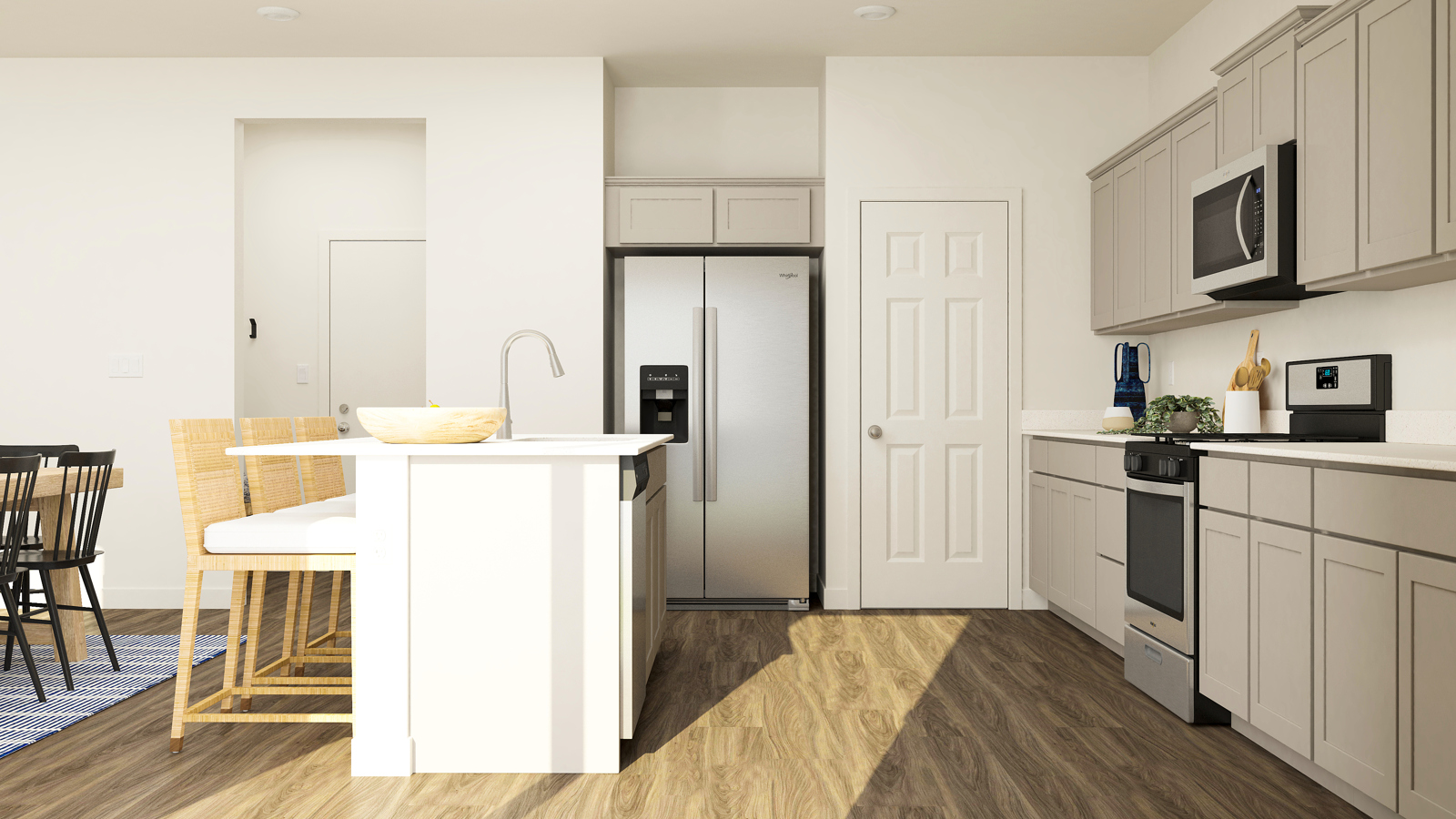 A kitchen with white cabinets.