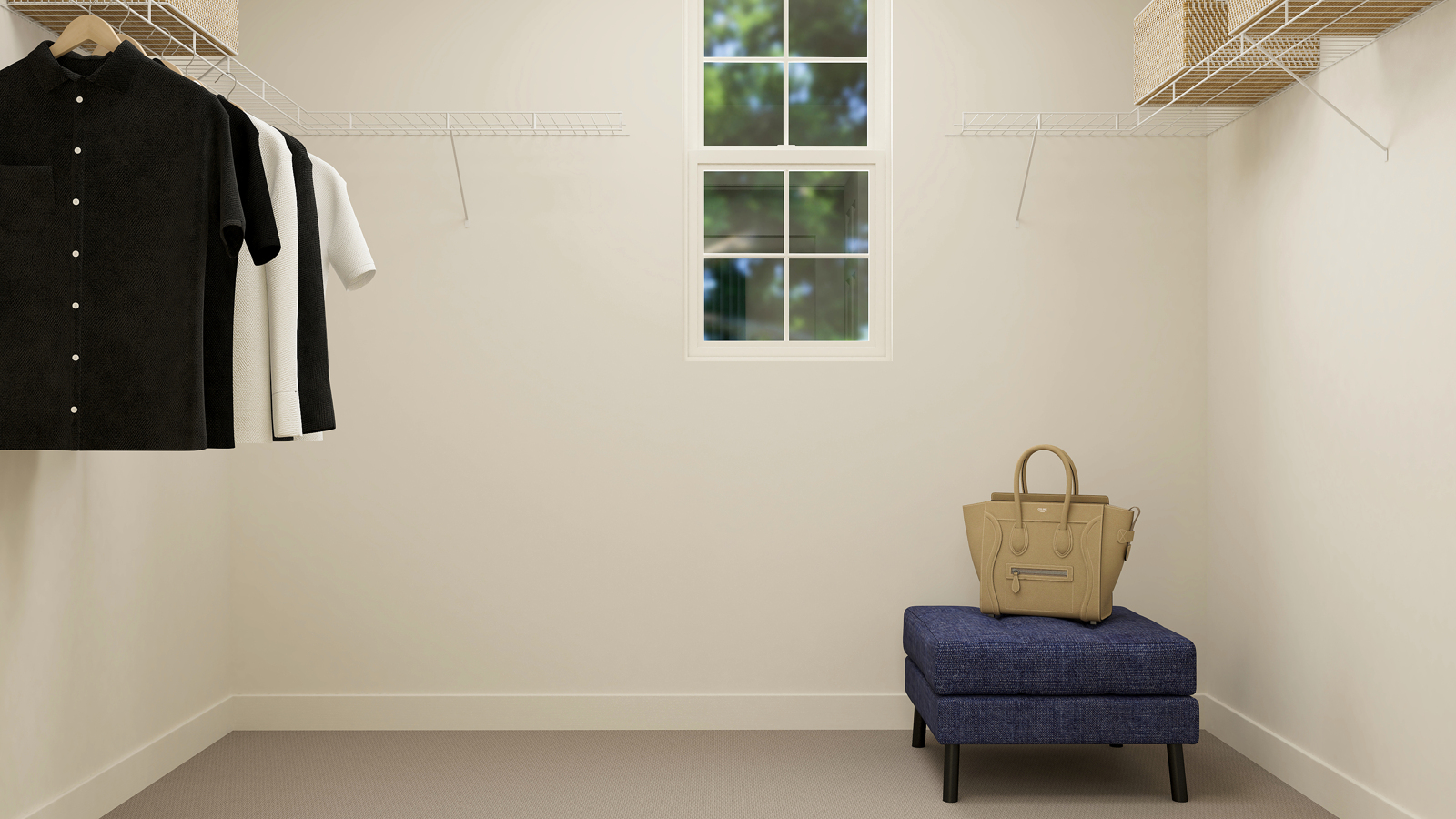 A room with a chair and clothes on the wall.