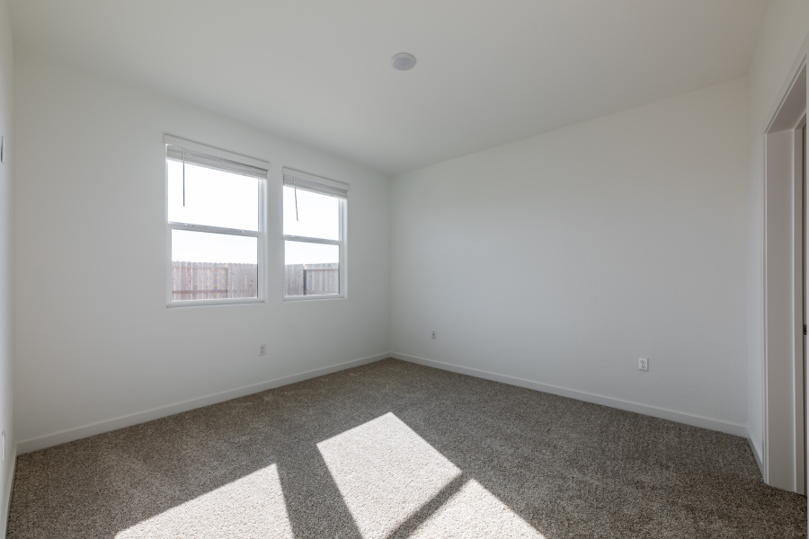 A room with a tile floor and windows.