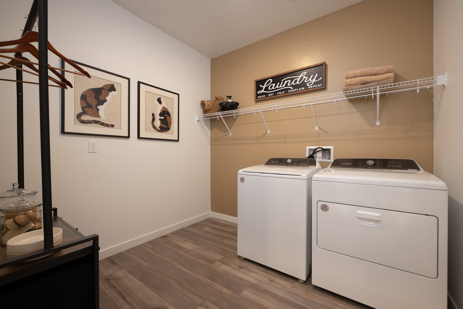 A kitchen with a white stove and a white refrigerator.