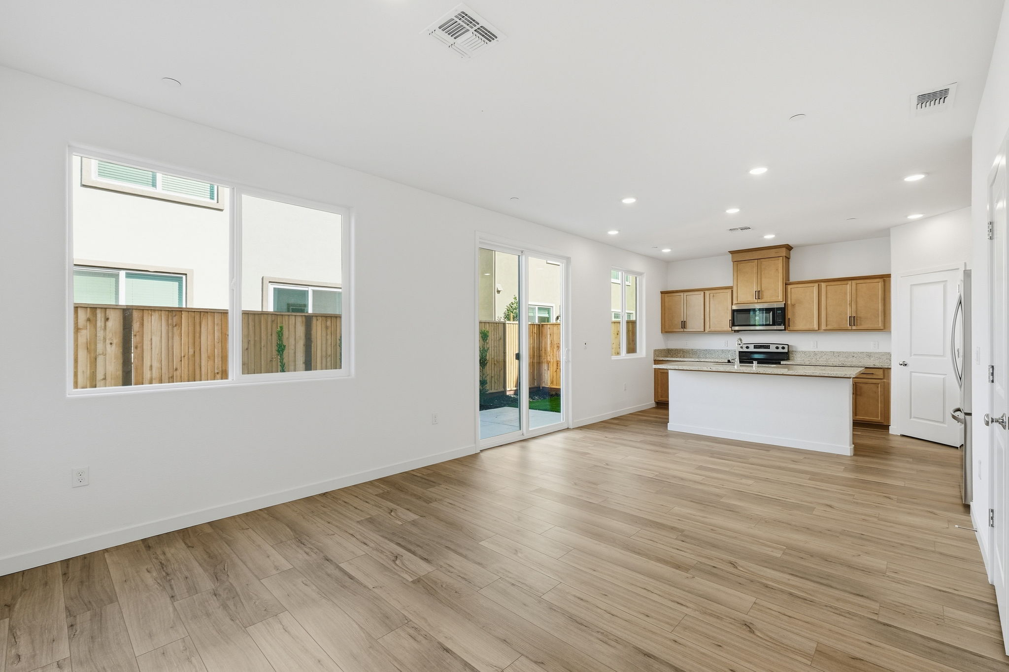 A kitchen with wooden floors.