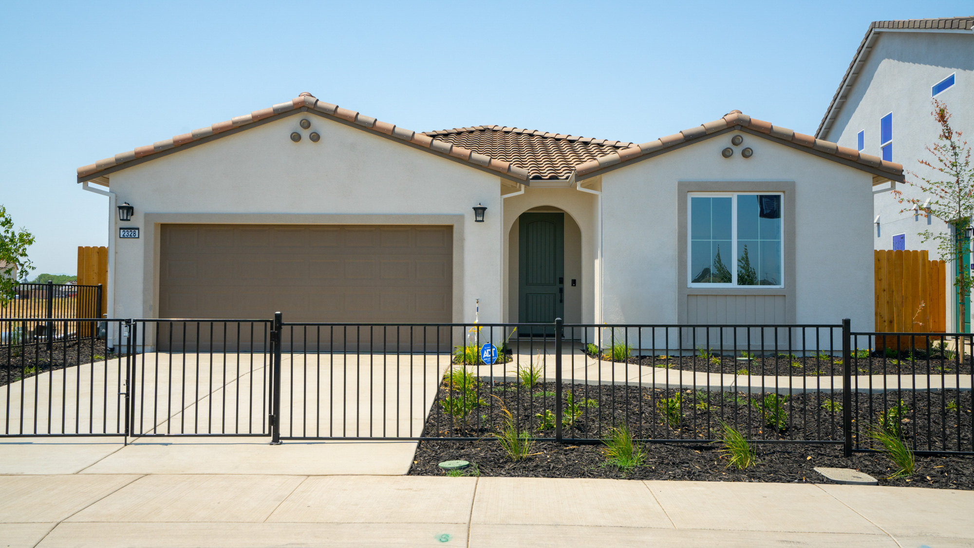 A house with a black fence.