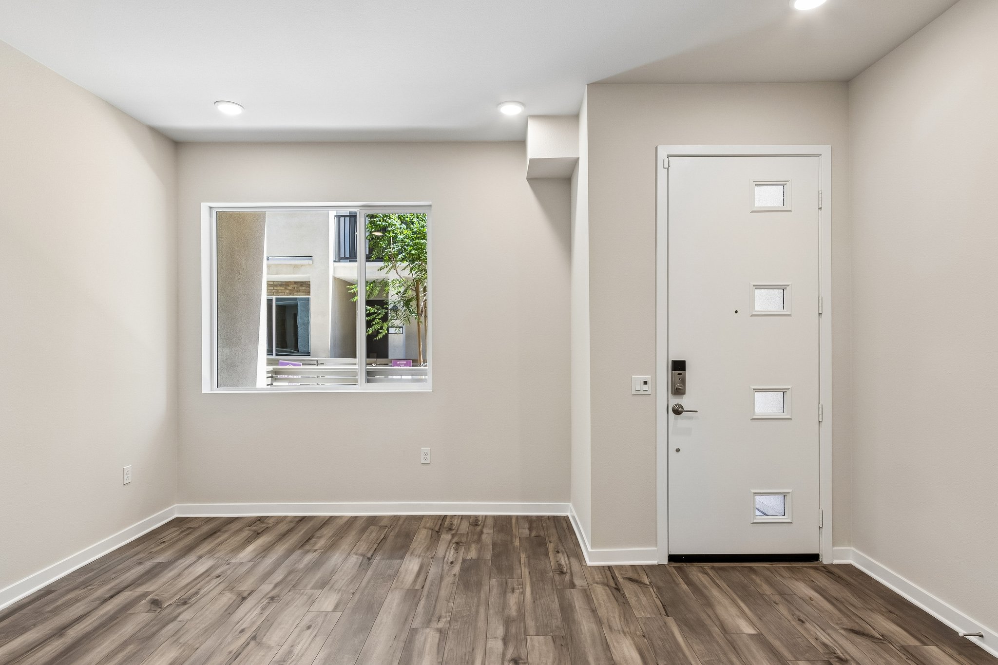 A room with a door and a window.