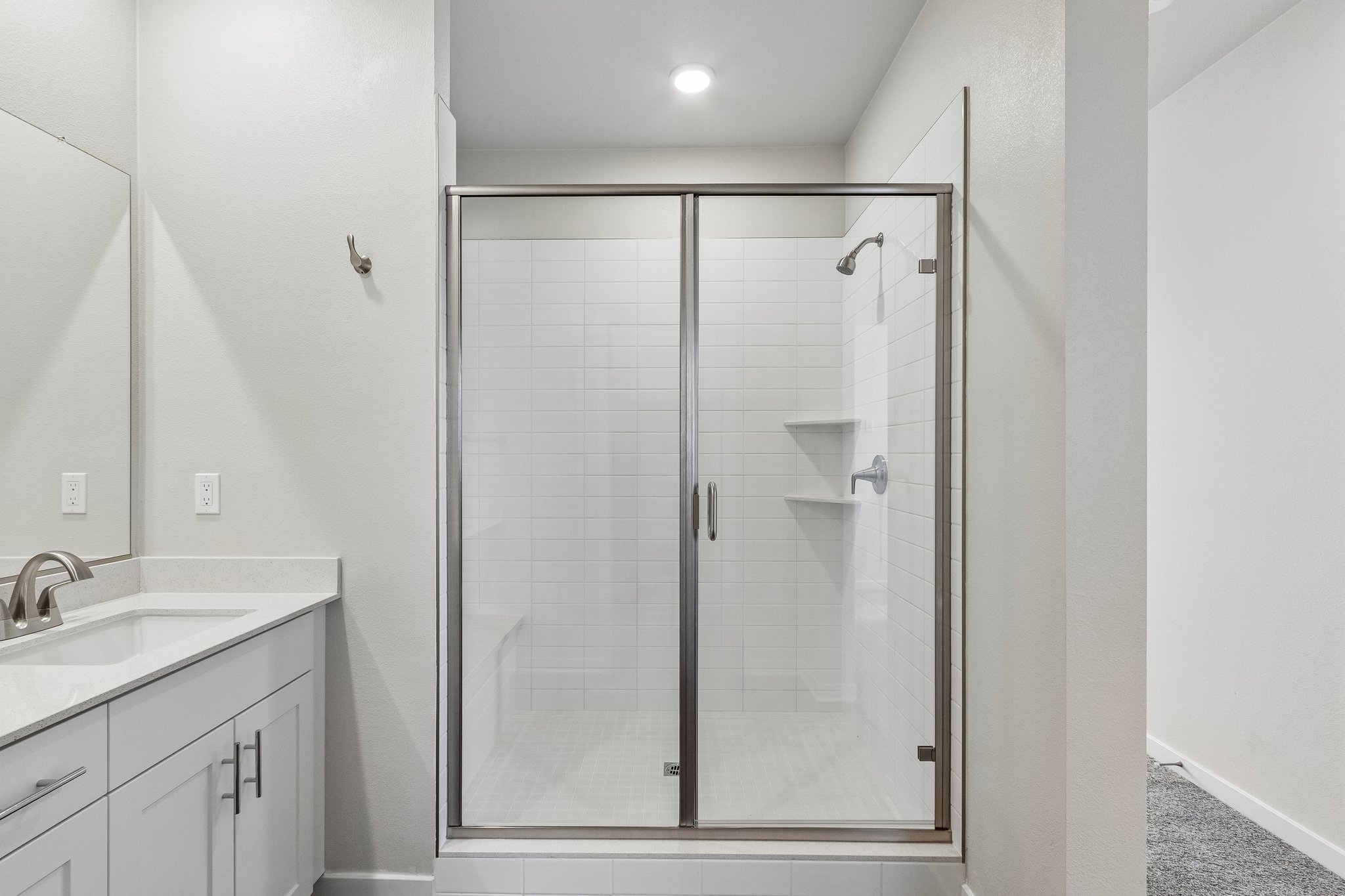 A bathroom with a glass shower.