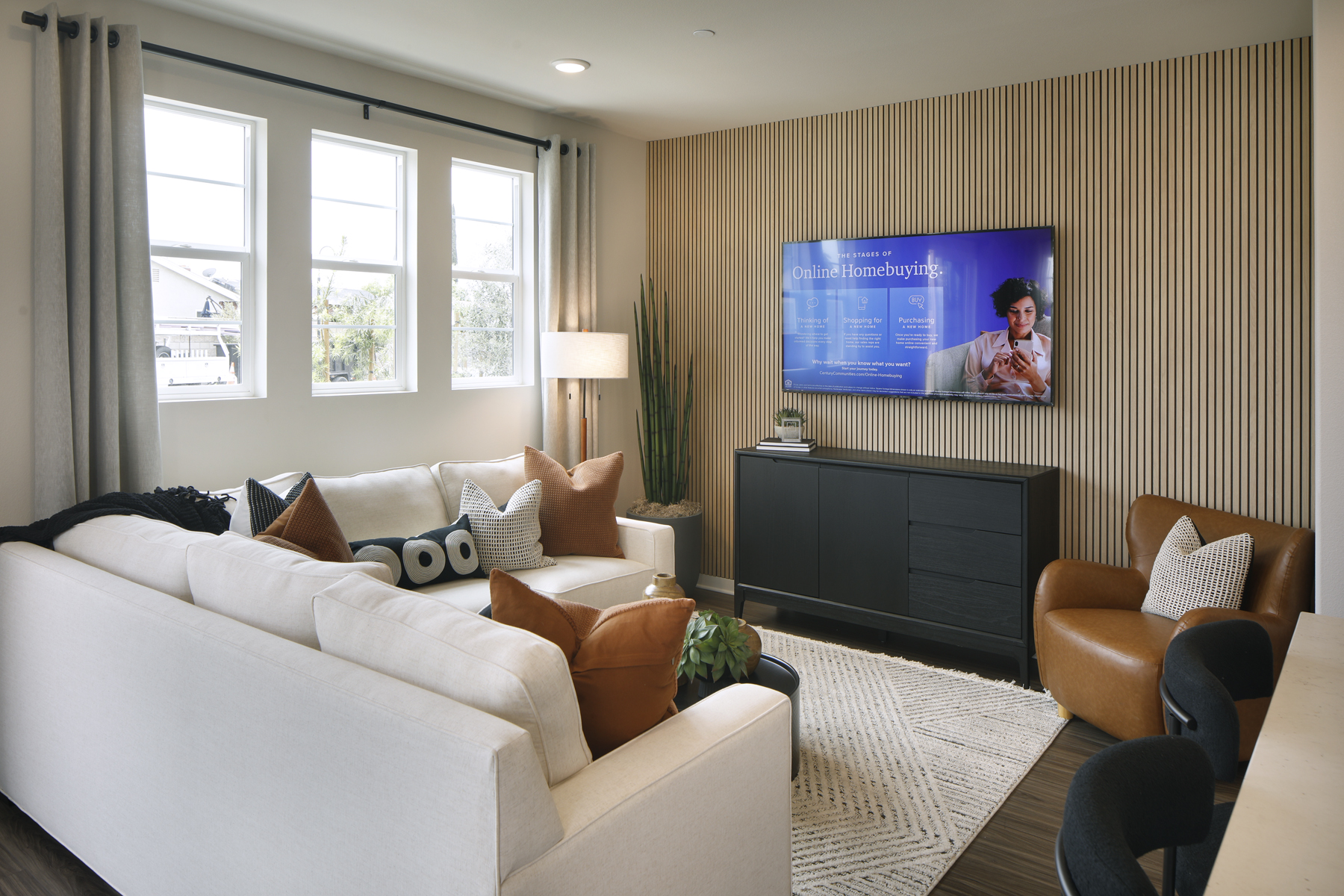 A living room with a tv and couches.