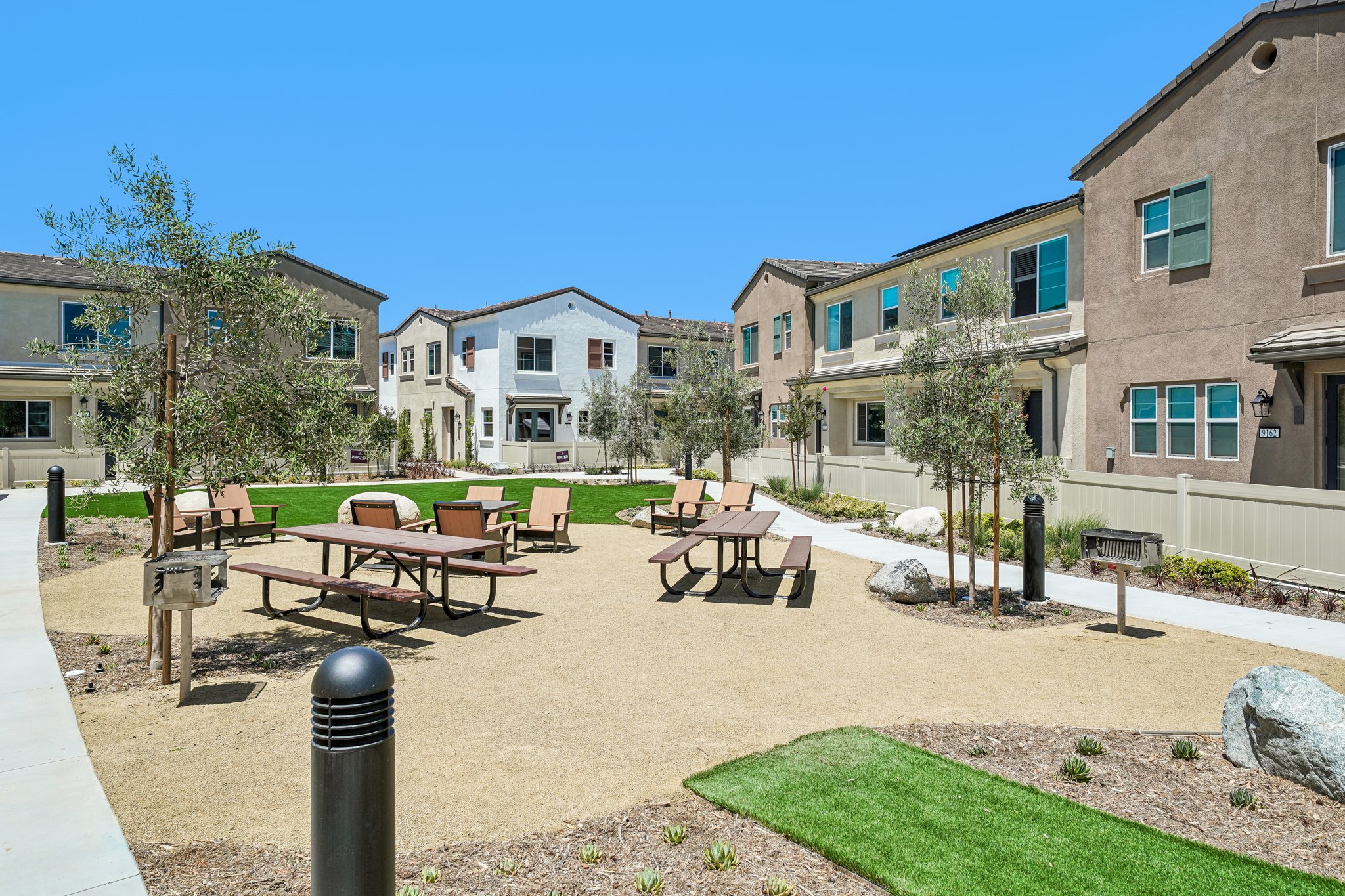 A courtyard with tables and chairs.