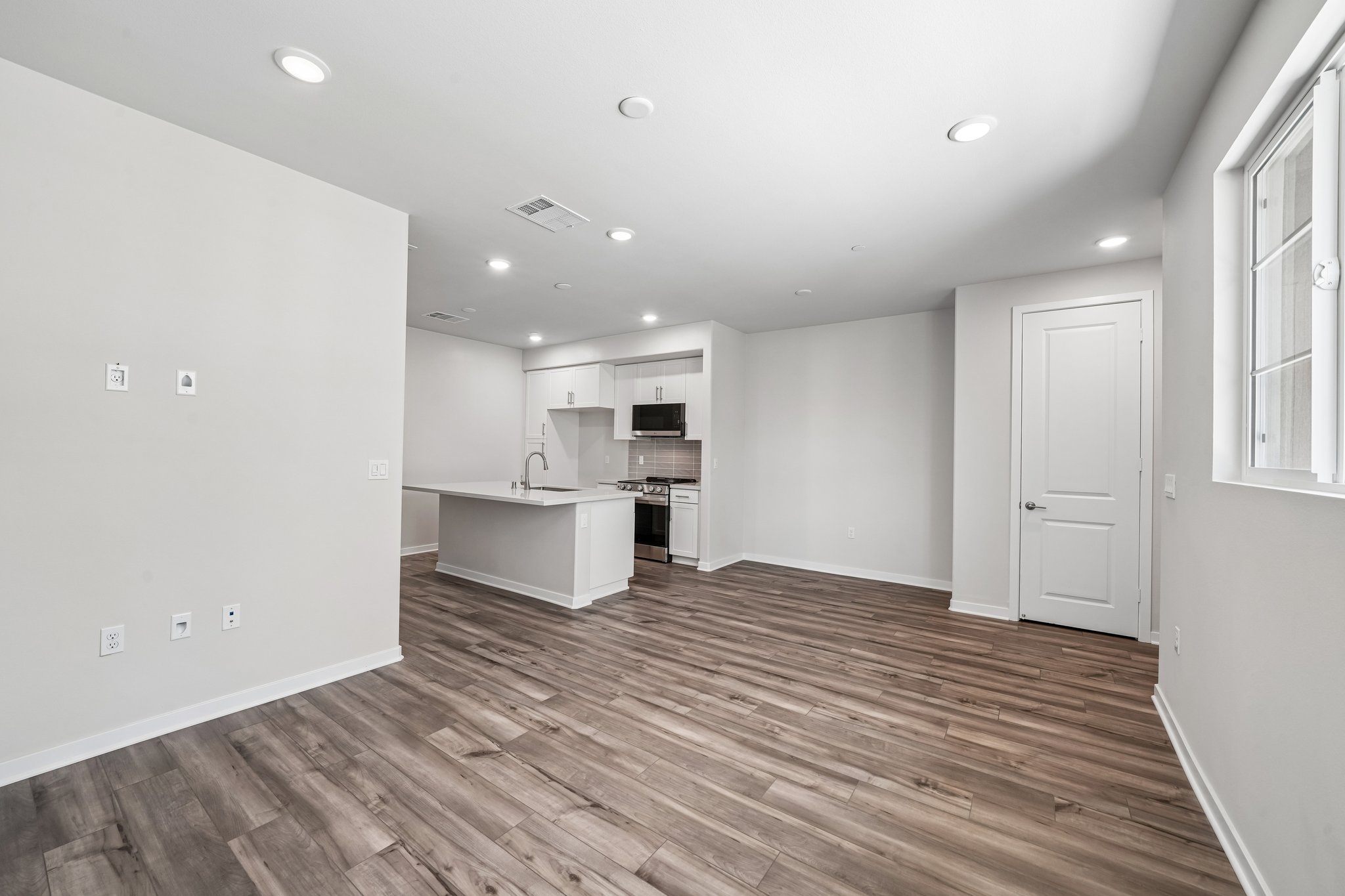 A kitchen with white walls.