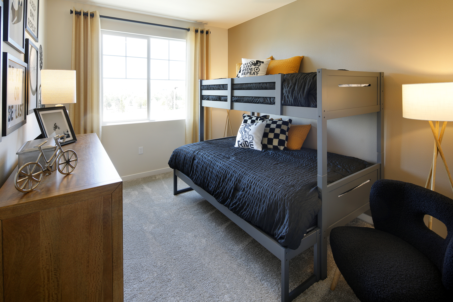 A bedroom with a desk and a bed.