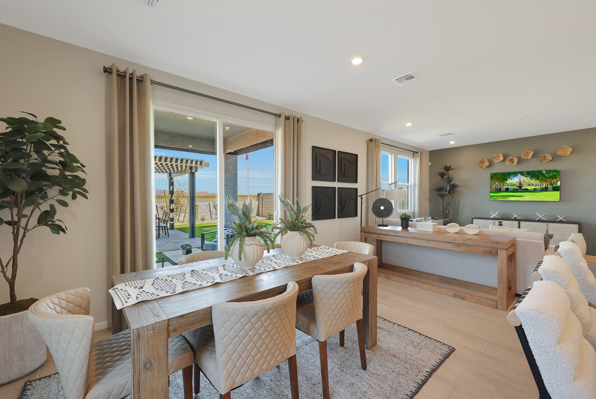 A dining room with a large window.