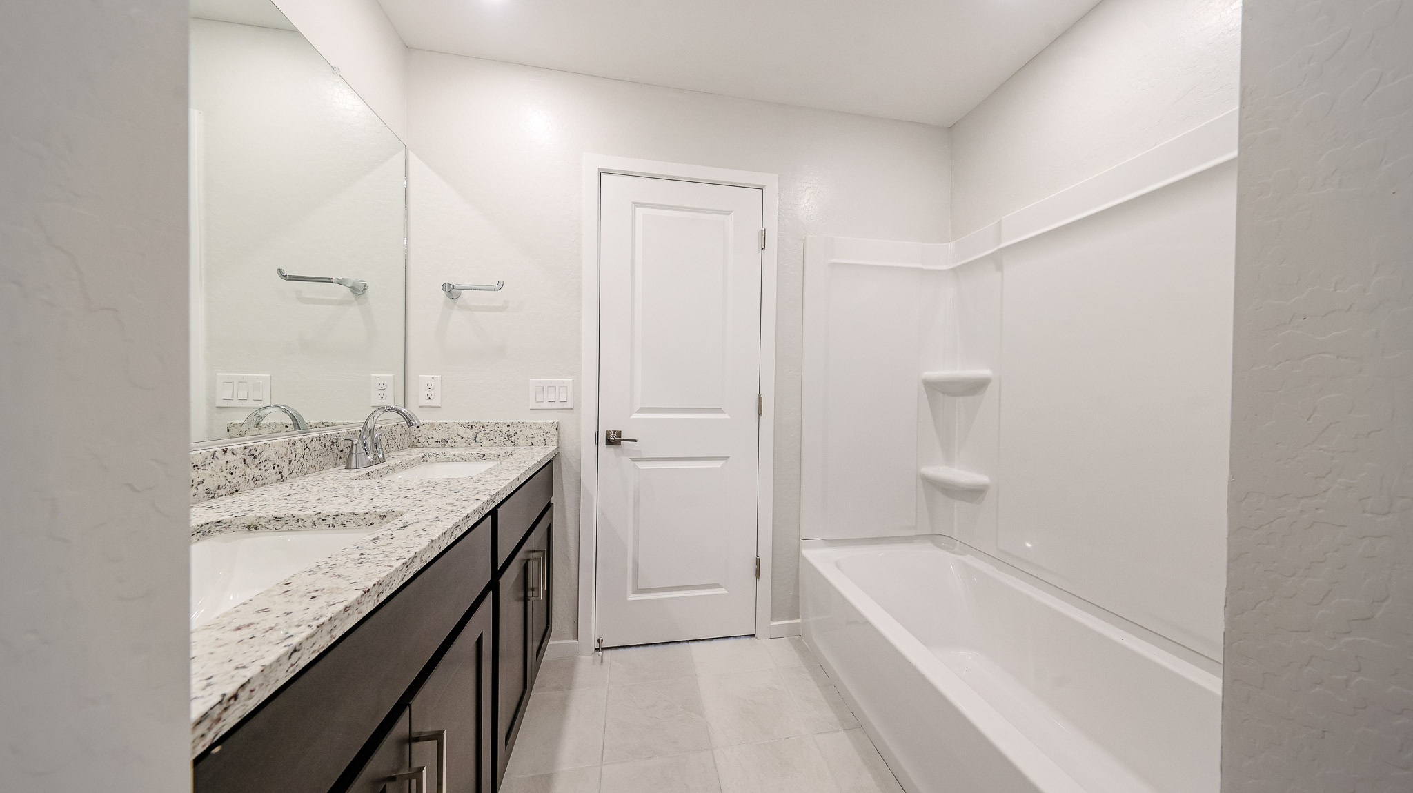 A bathroom with a marble countertop.