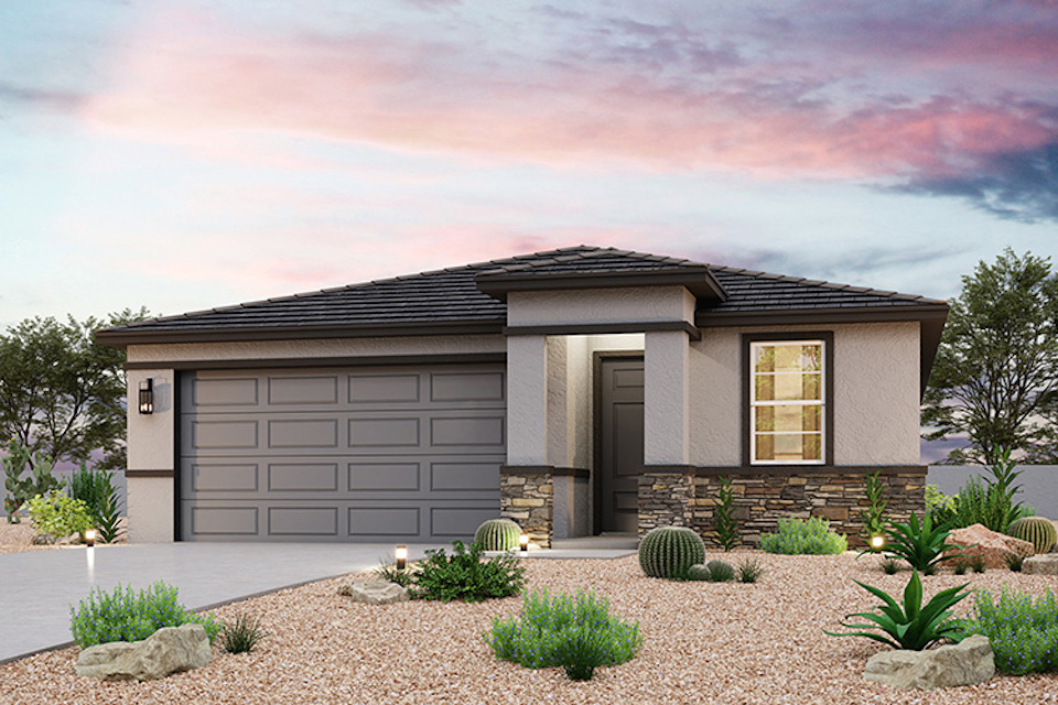A house with a gravel driveway.