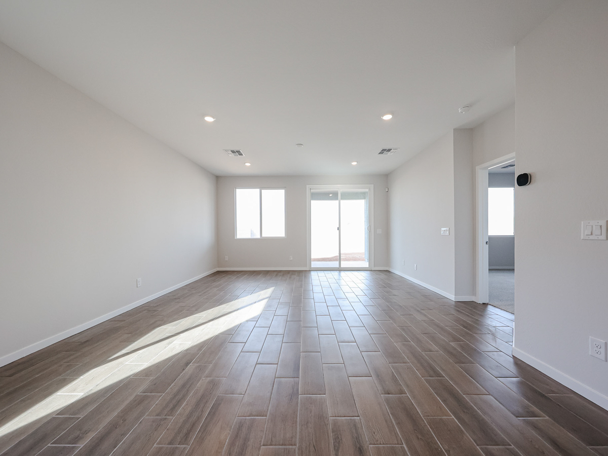 A room with a wood floor and a wood floor.