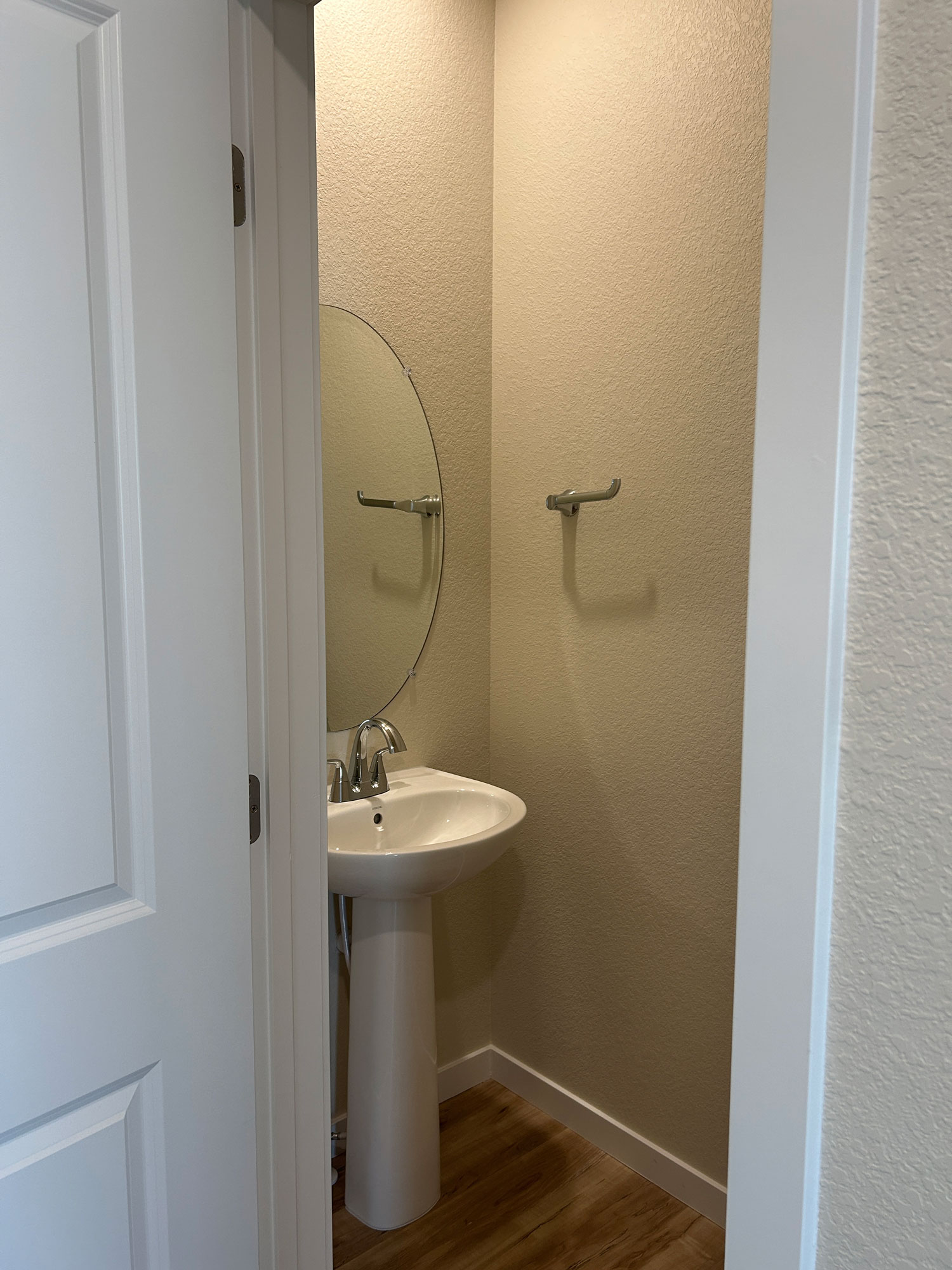 A bathroom with a mirror and sink.