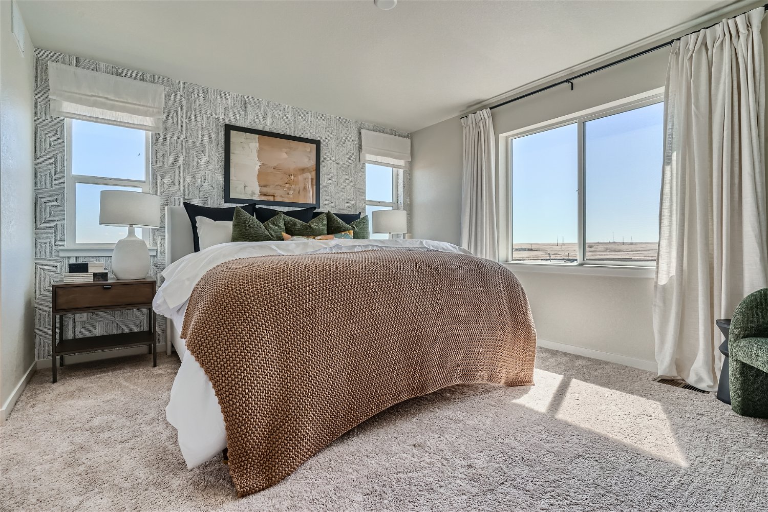 A bedroom with a large bed.