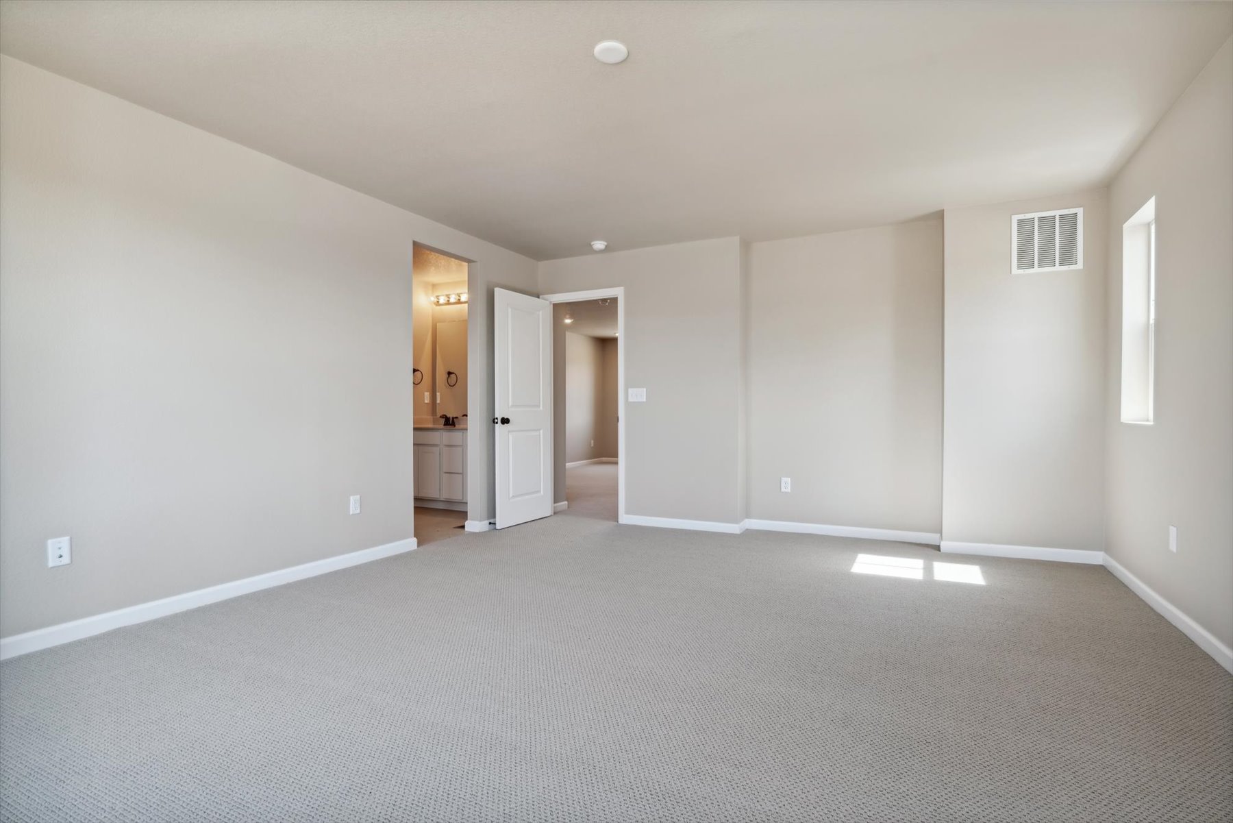A long hallway with white walls.