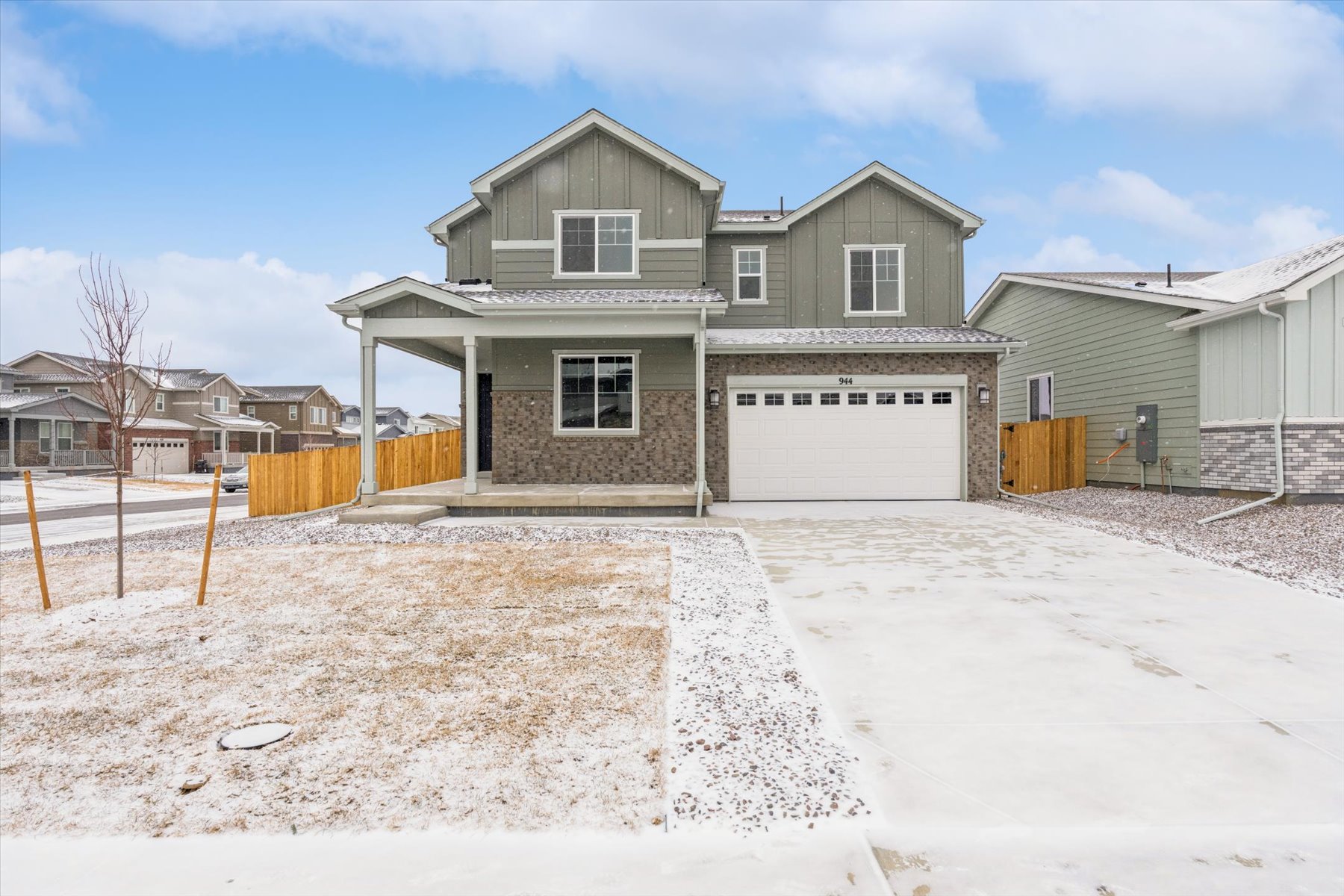 A house with a garage and a fence around it.