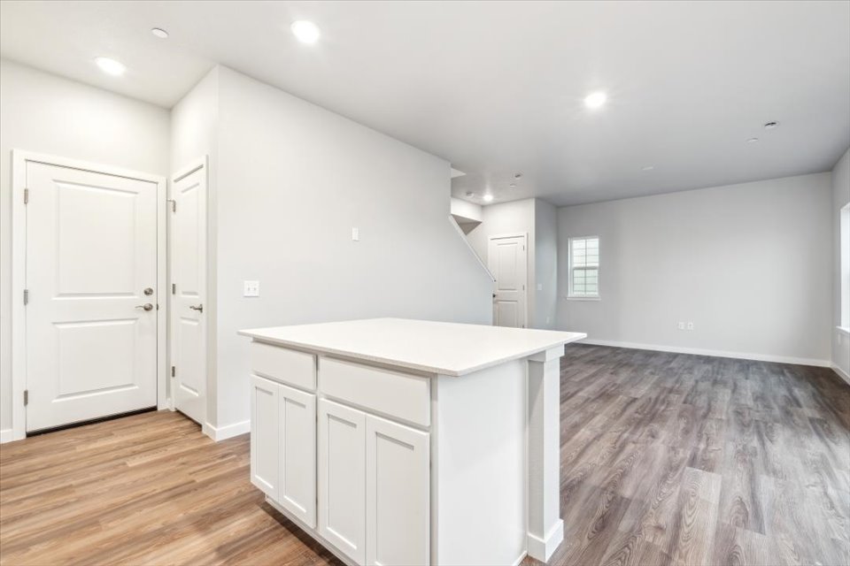 A room with white cabinets.