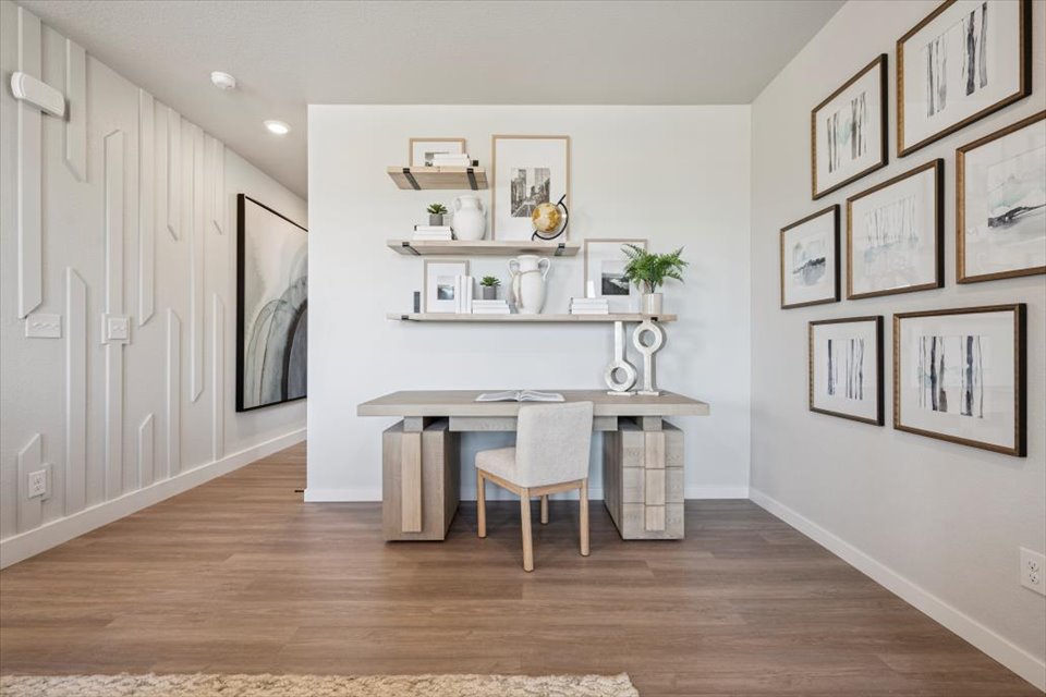 A room with a table and chairs.