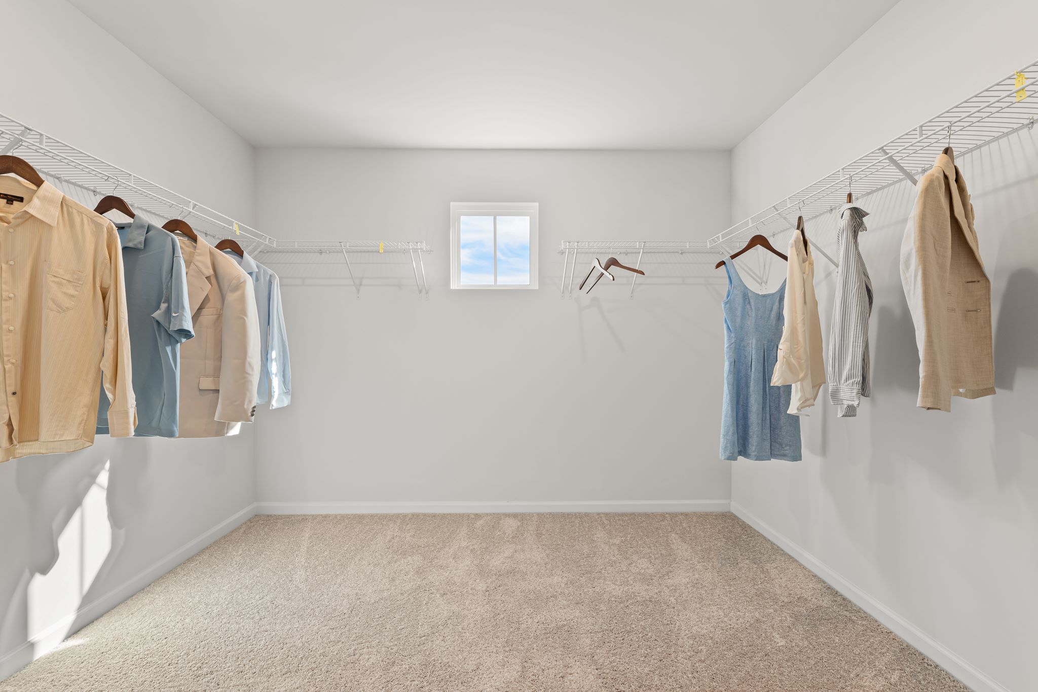 A room with clothes on the swingers.