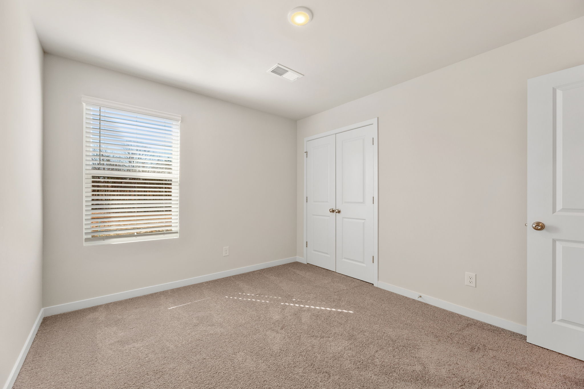 A room with white doors.