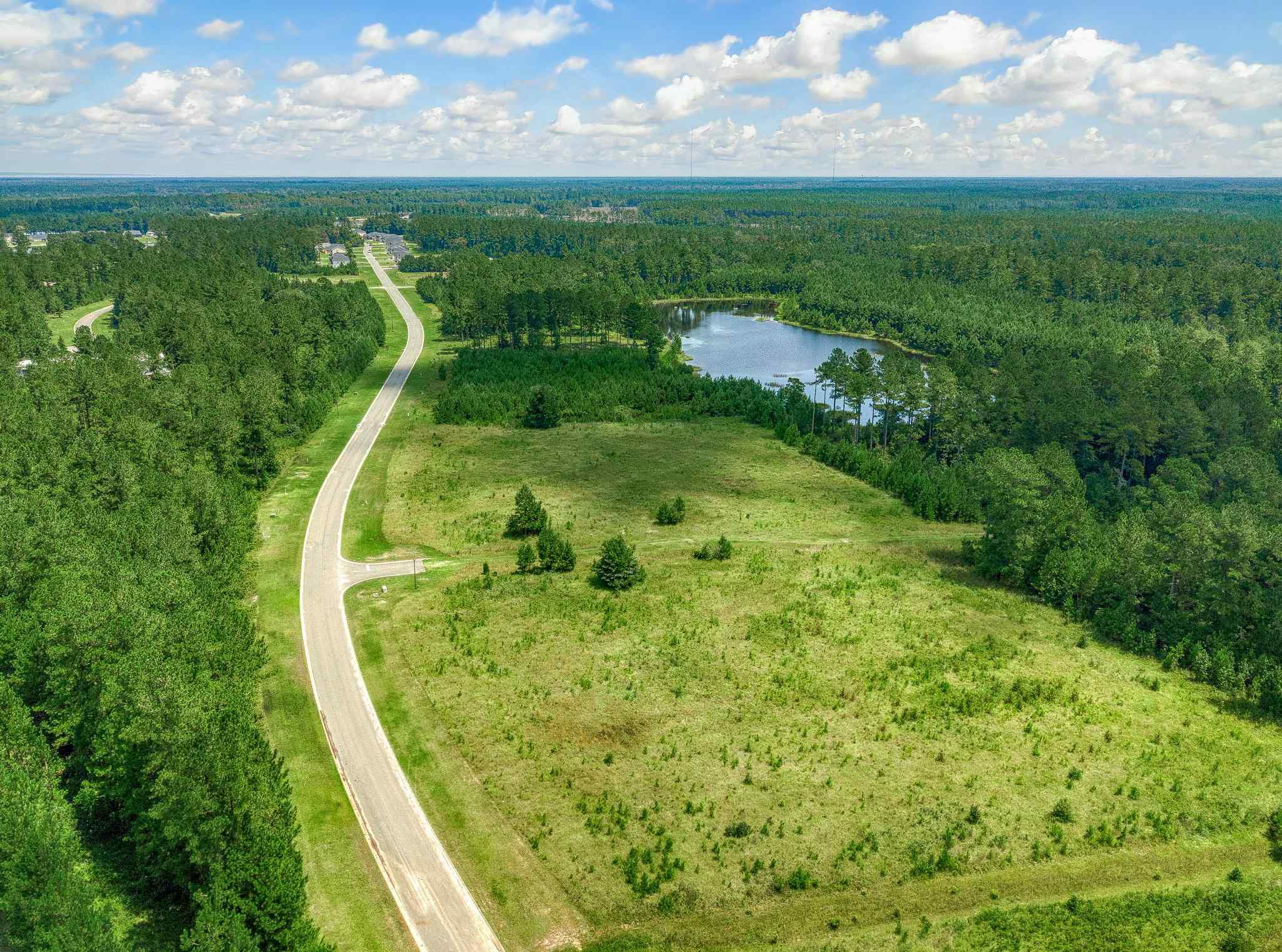 A river running through a grassy area.