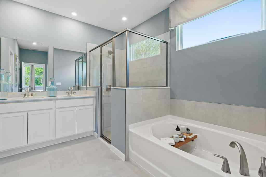 A bathroom with a large glass shower.