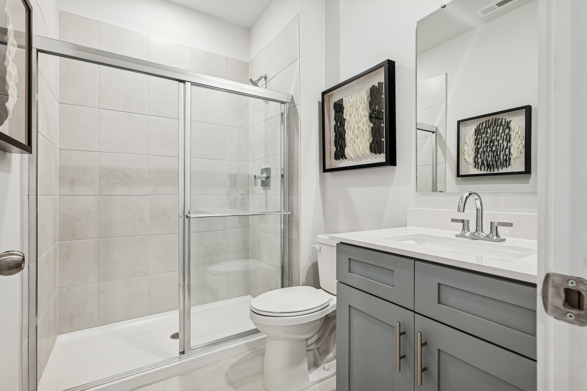 A bathroom with a glass shower.