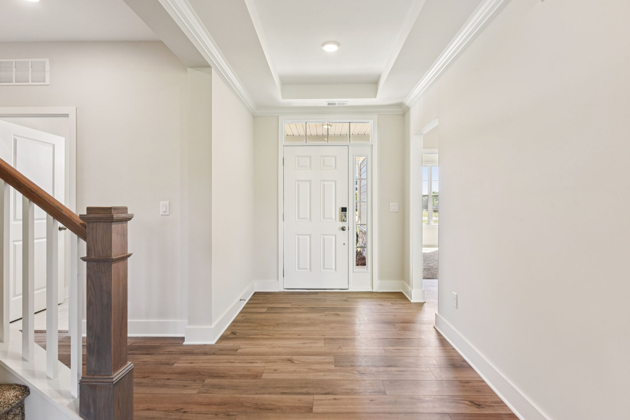 A hallway with white walls.