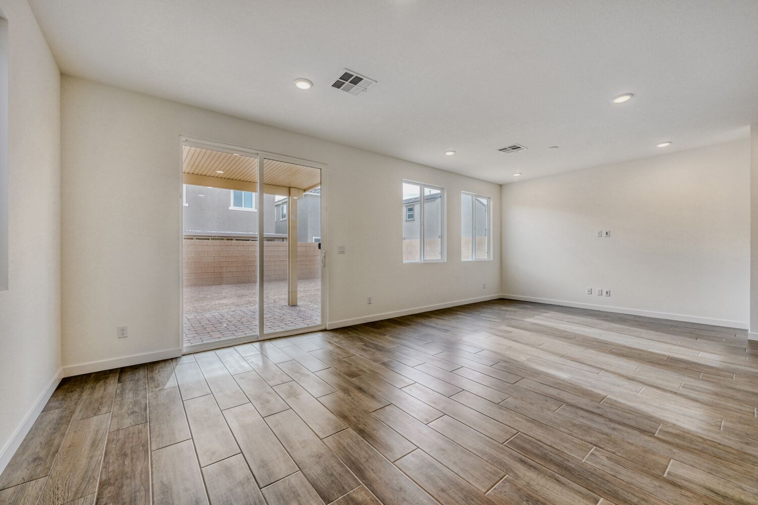 A room with a wood floor and a wood floor.