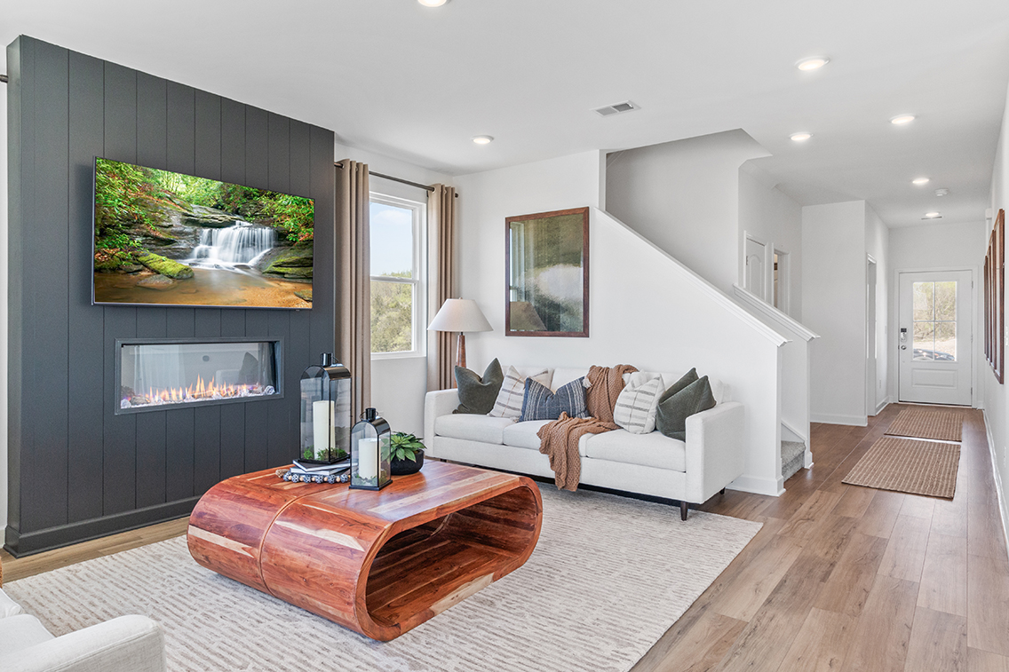 A living room with a fireplace.