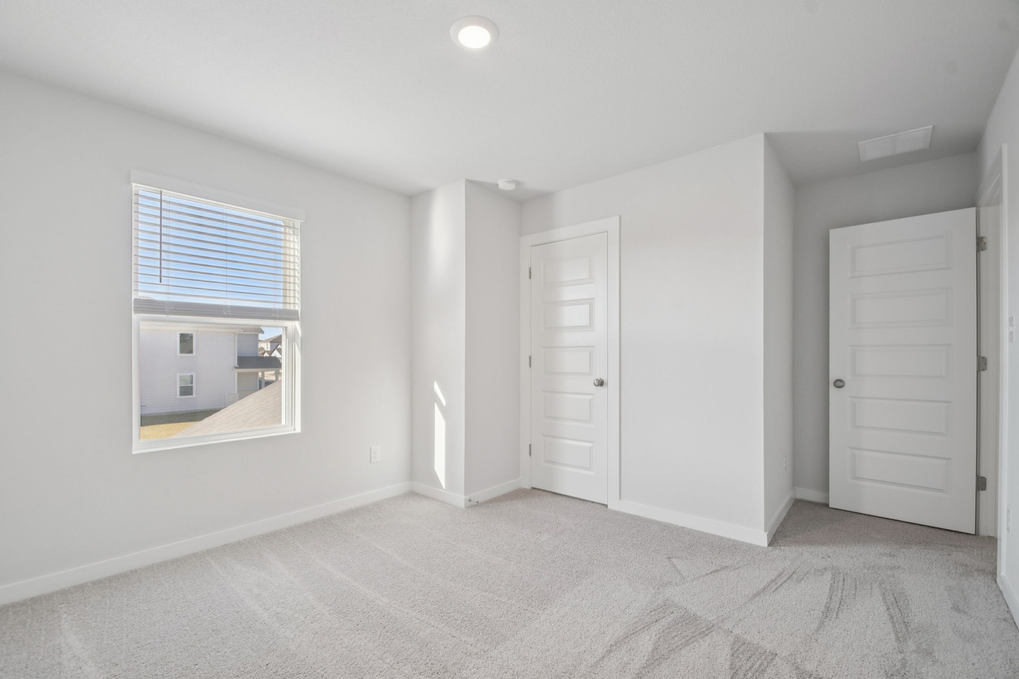 A room with white doors.