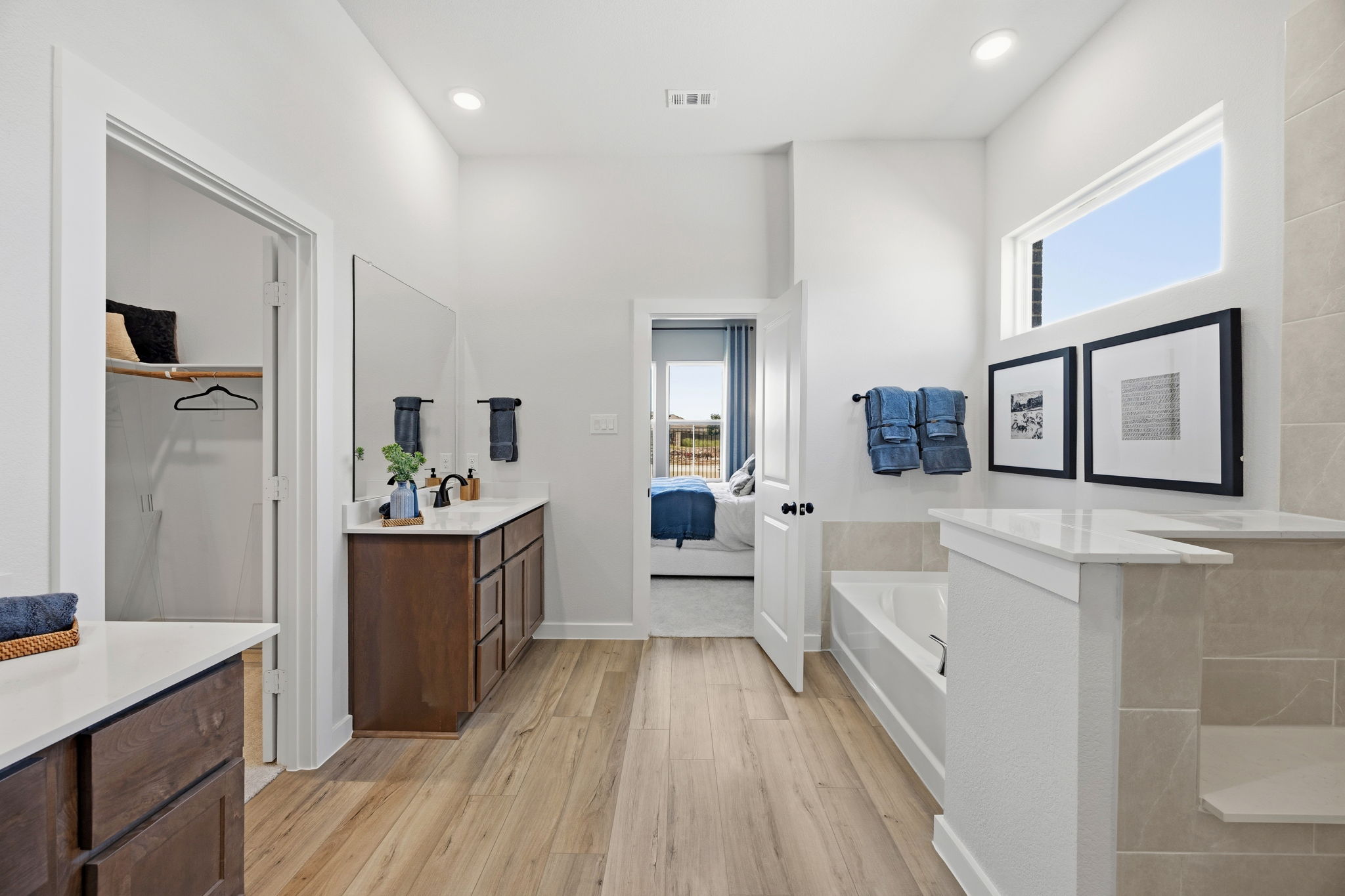 A bathroom with a tub sink and a toilet.