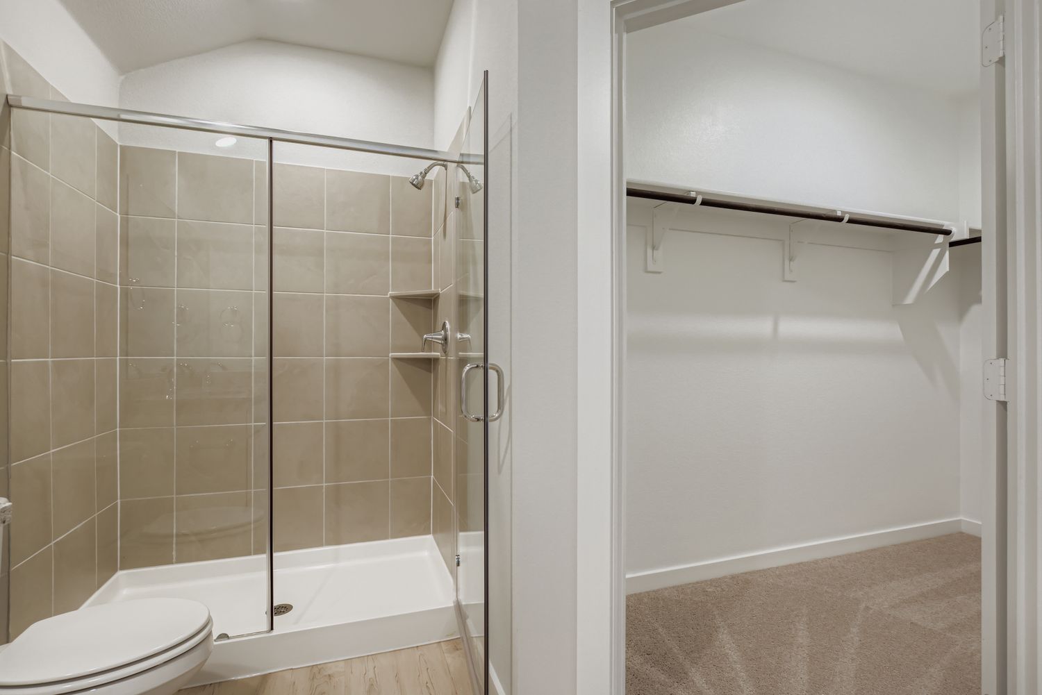 A bathroom with a shower unit.