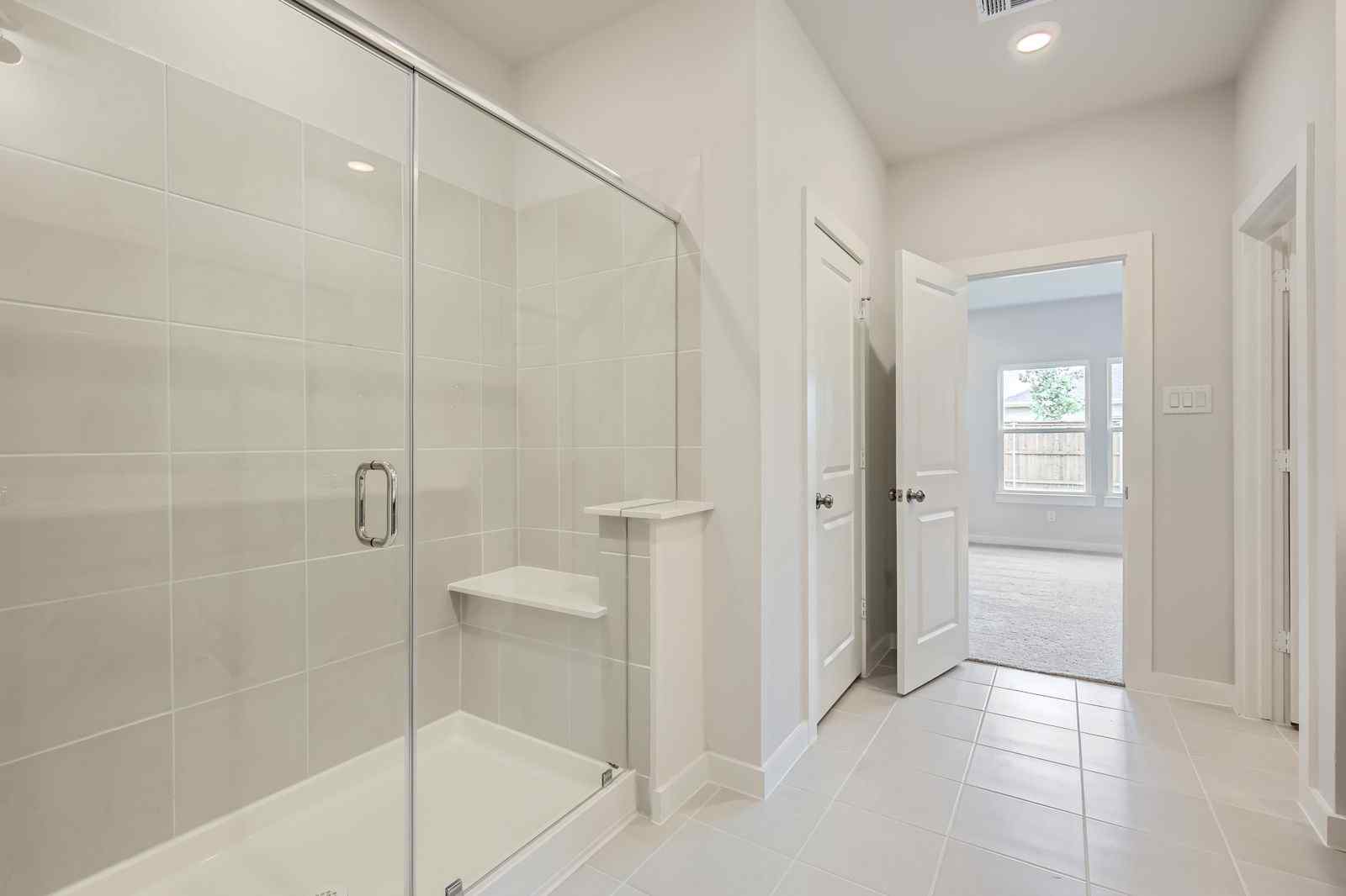 A bathroom with a glass shower.