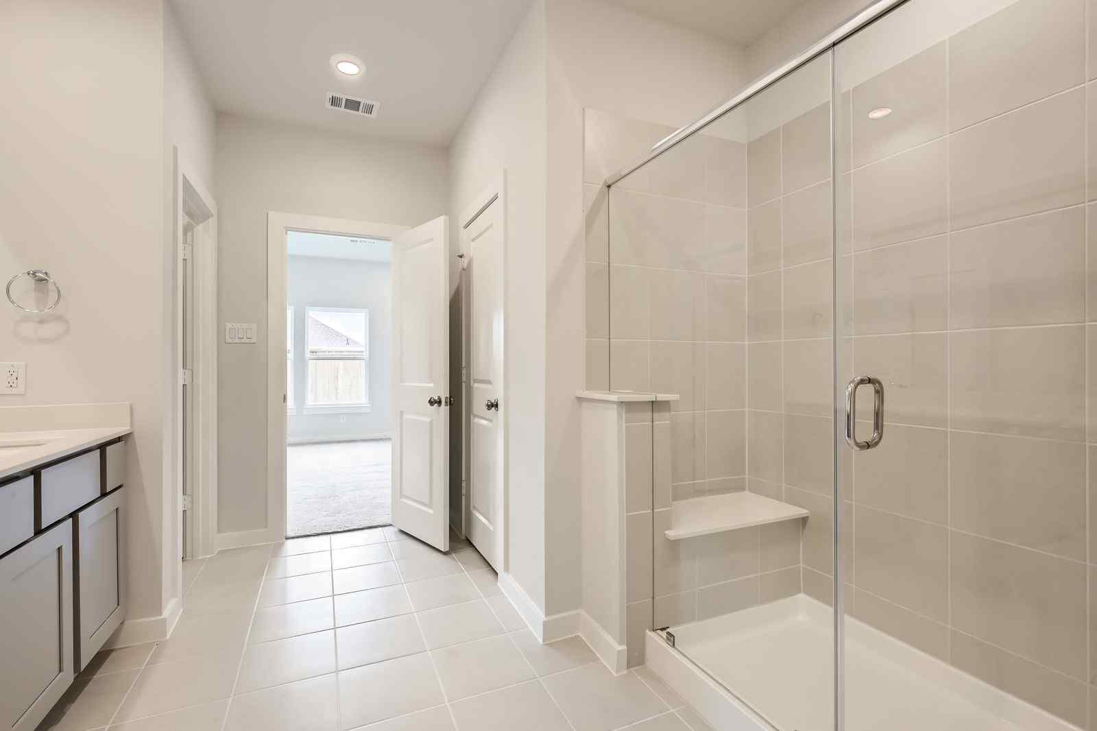 A bathroom with a glass shower.