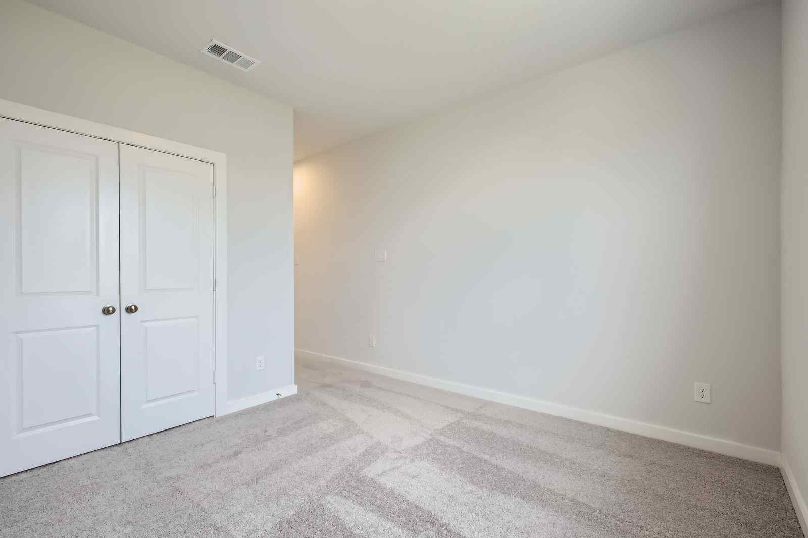 A room with white doors.