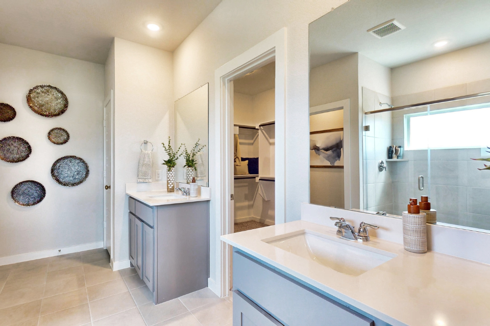 A bathroom with a large mirror.