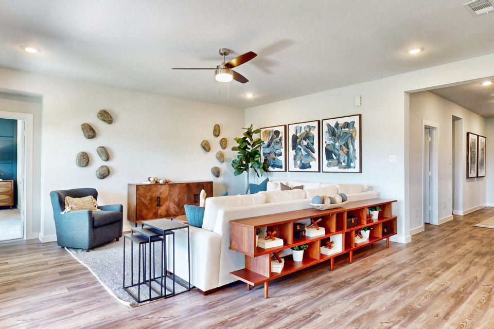 A living room with a bed and a couch.