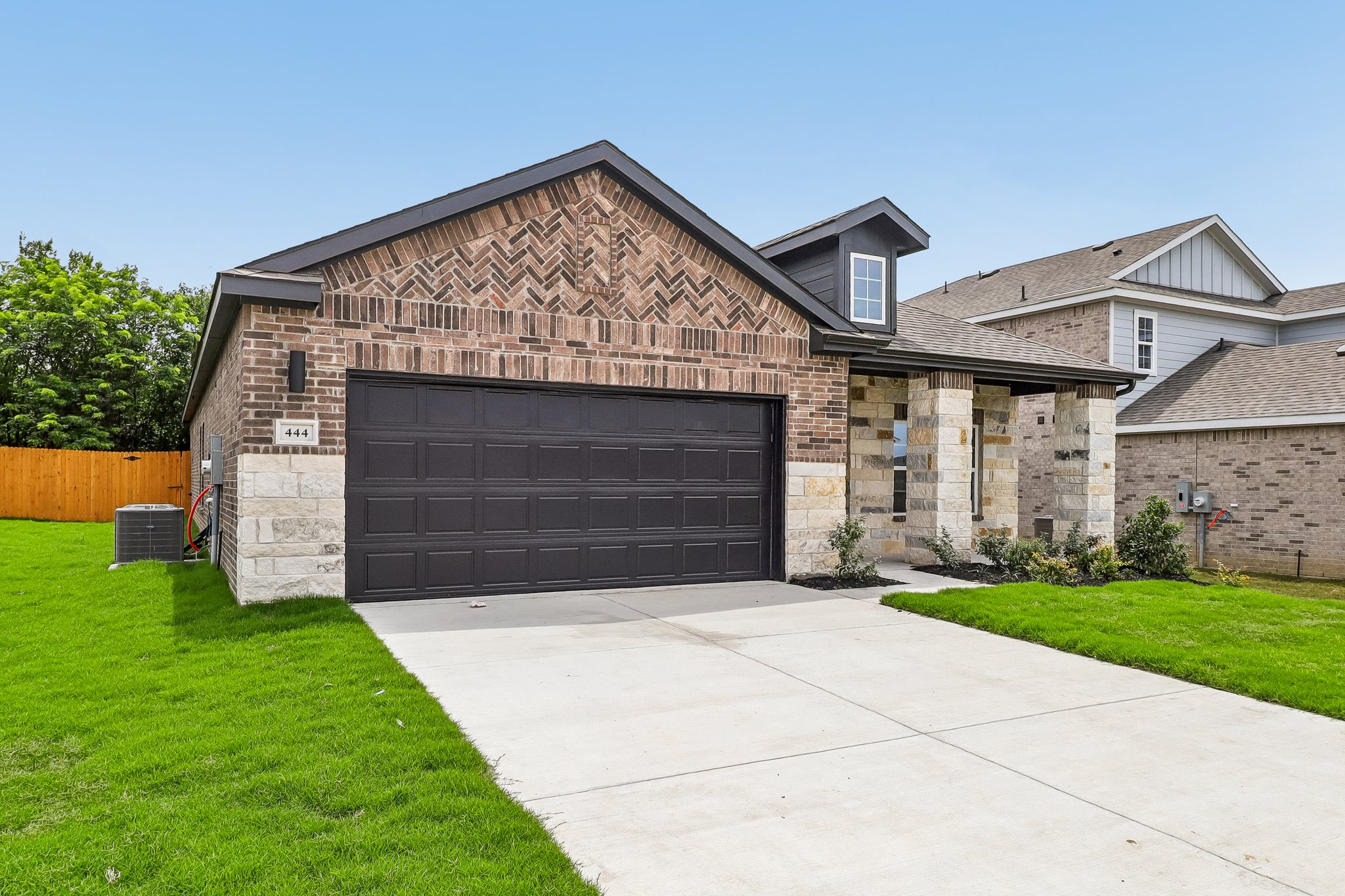 A large brick building with a garage.