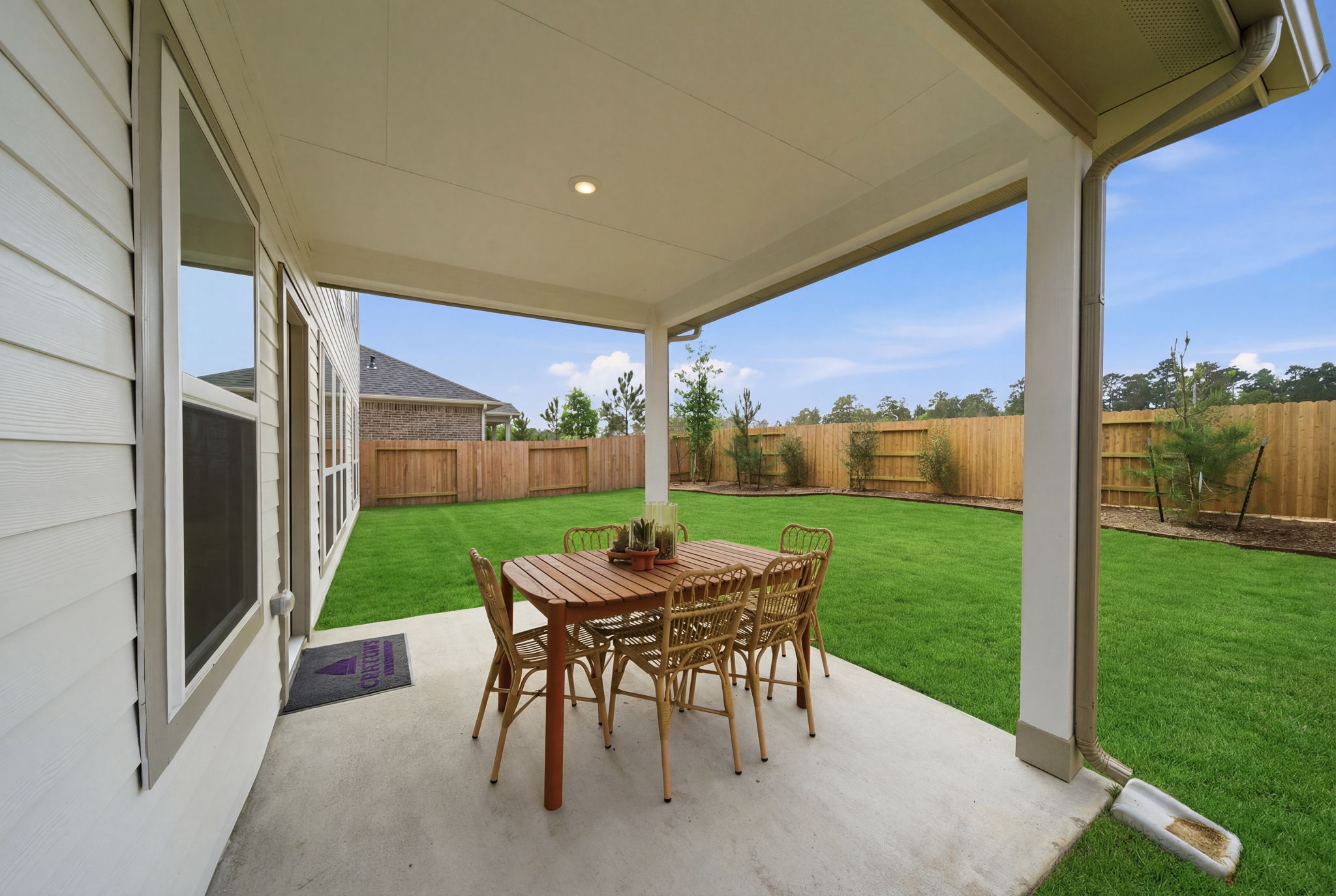 A table and chairs on a deck.