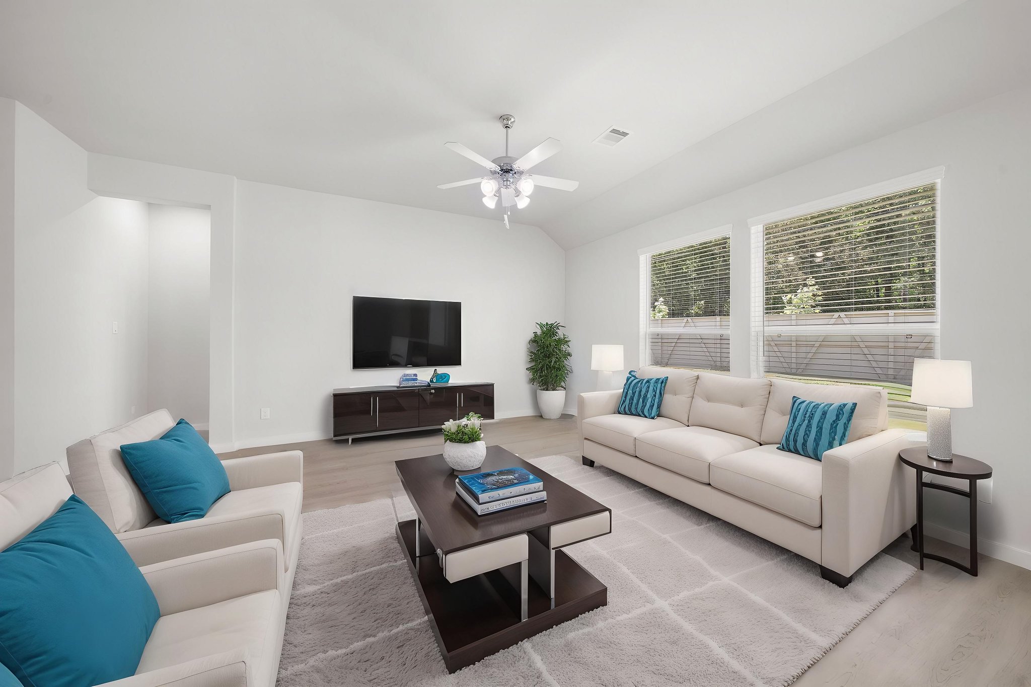 A living room with a tv and couches.