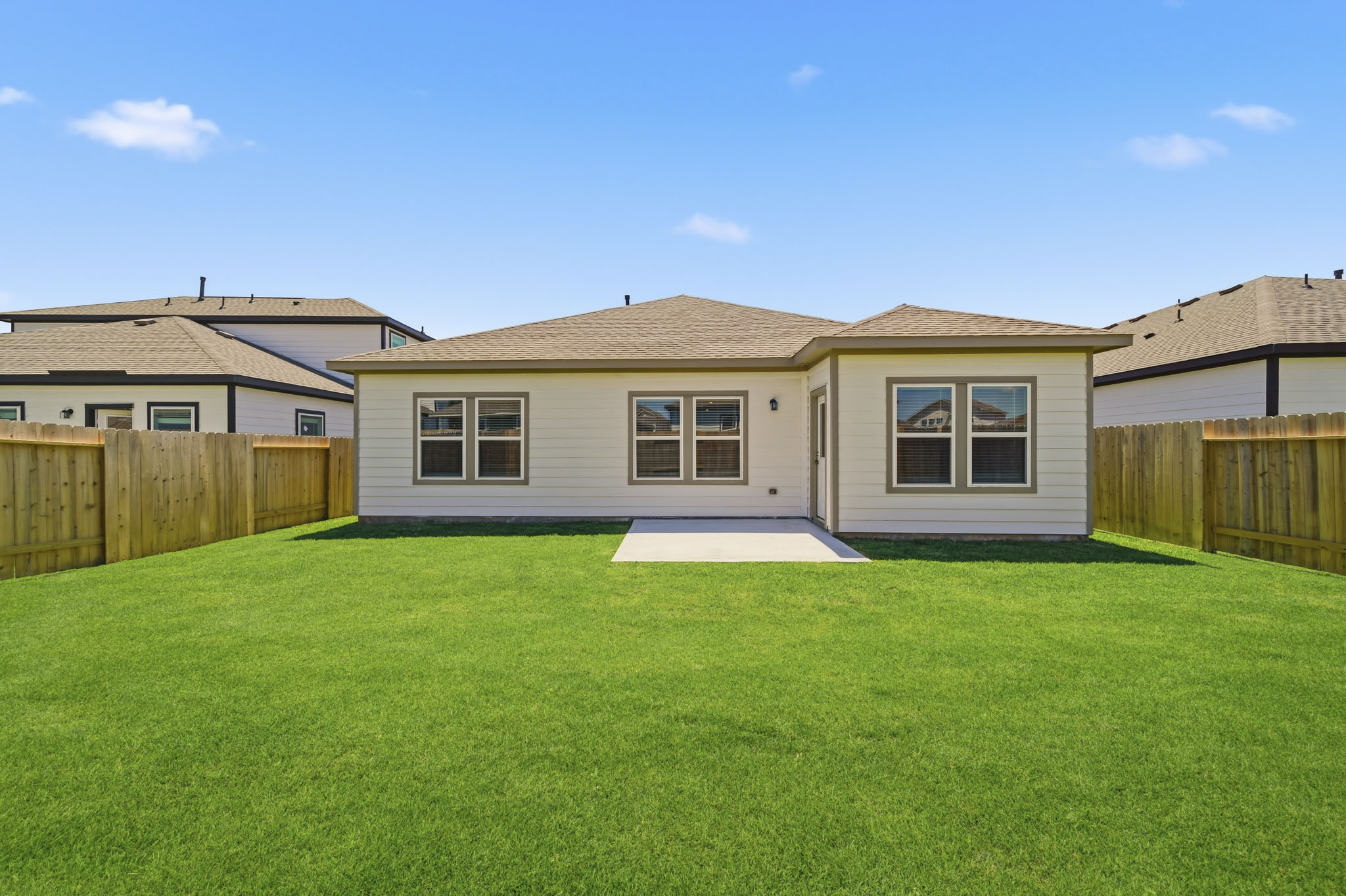 A house with a green lawn.