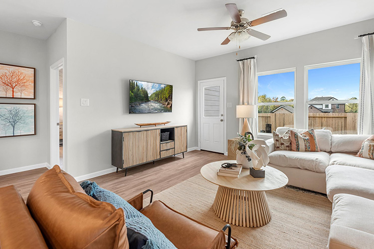 A living room with a large window.