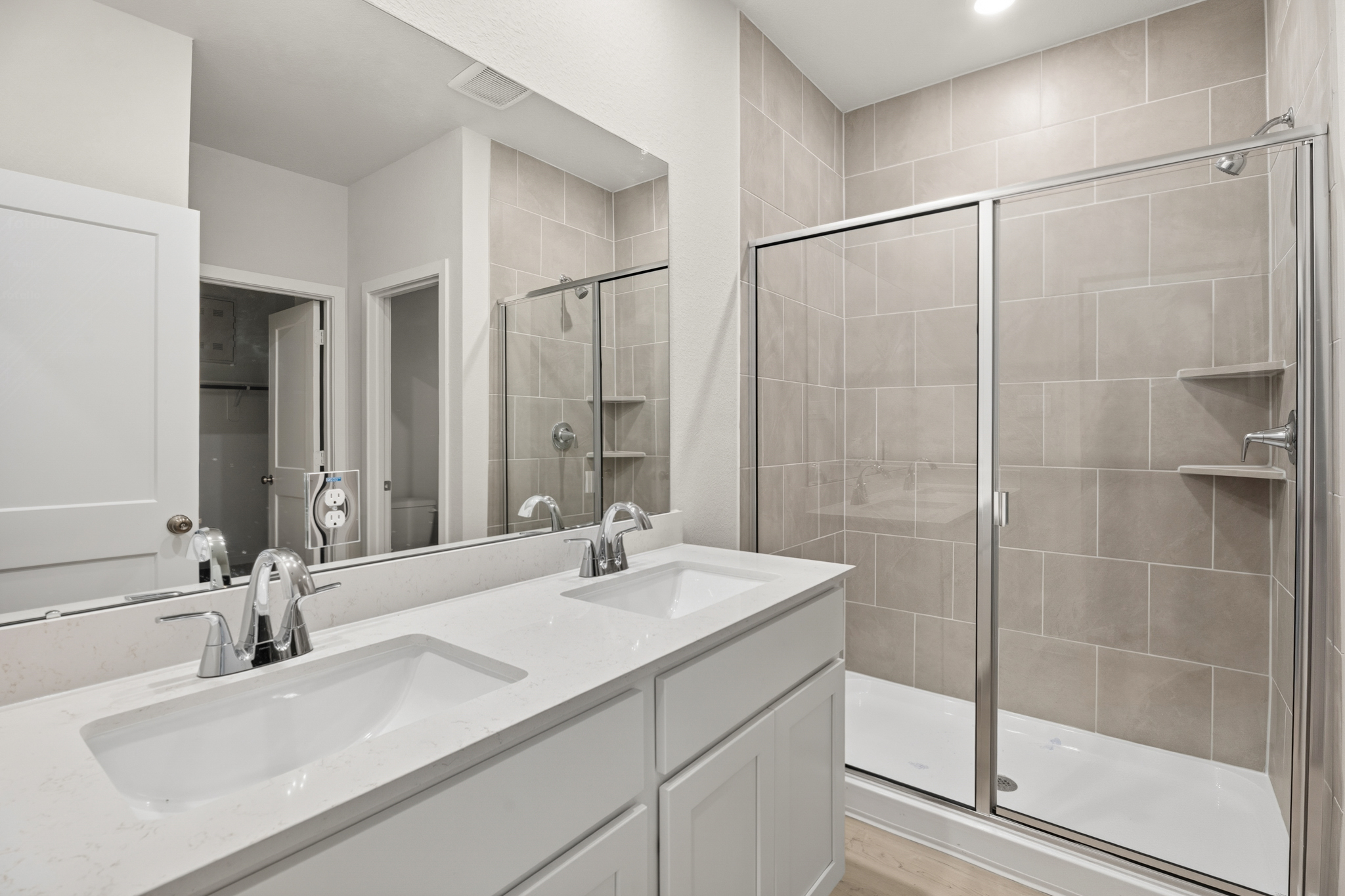 A bathroom with a glass shower.