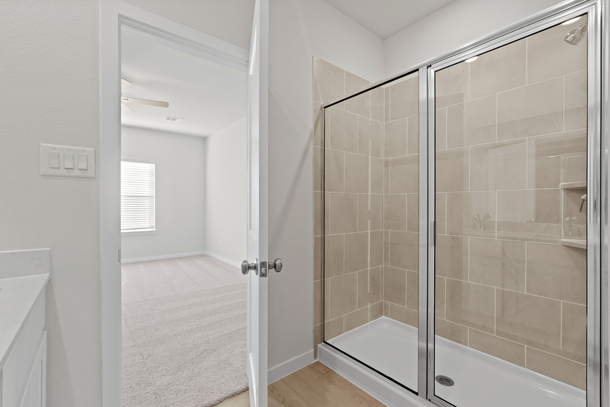 A bathroom with a glass shower.