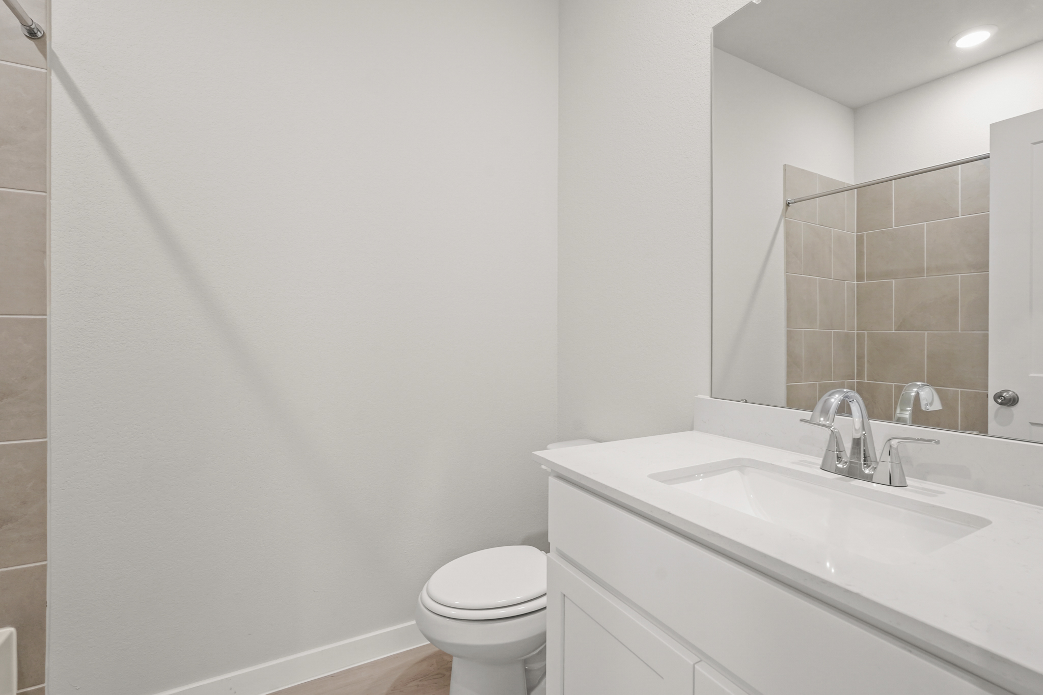 A bathroom with a sink and a toilet.